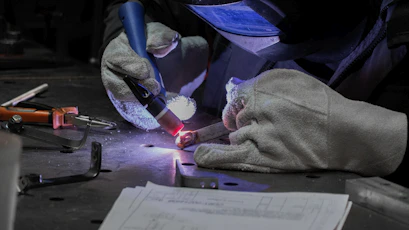 A man working on a piece of metal