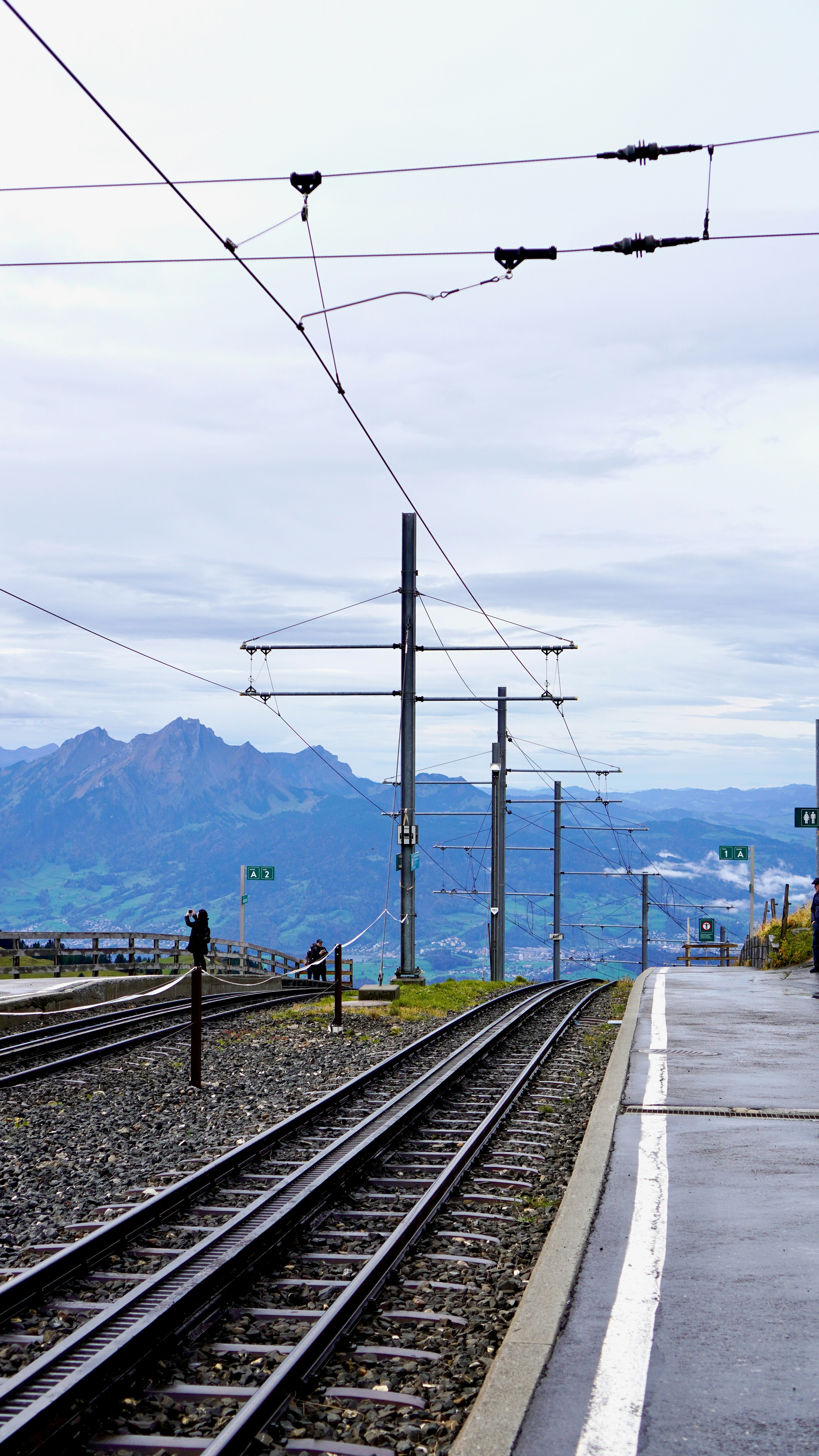 A train station with a train on the tracks