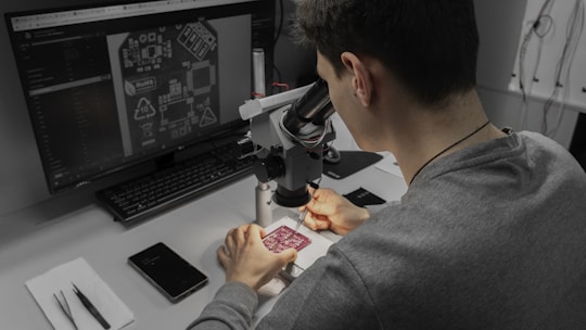A man sitting at a desk in front of a computer
