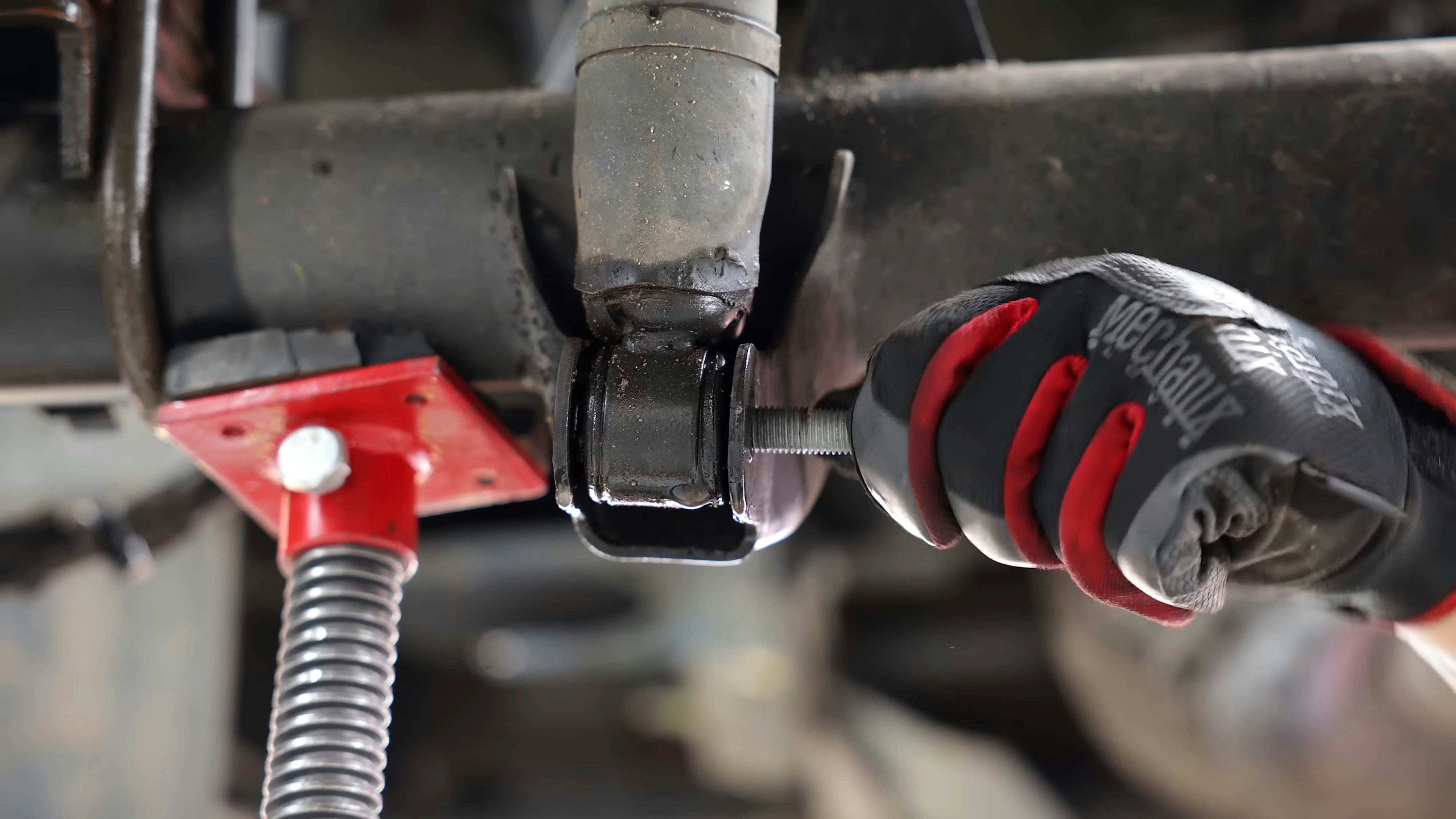 A close up of a person holding a wrench