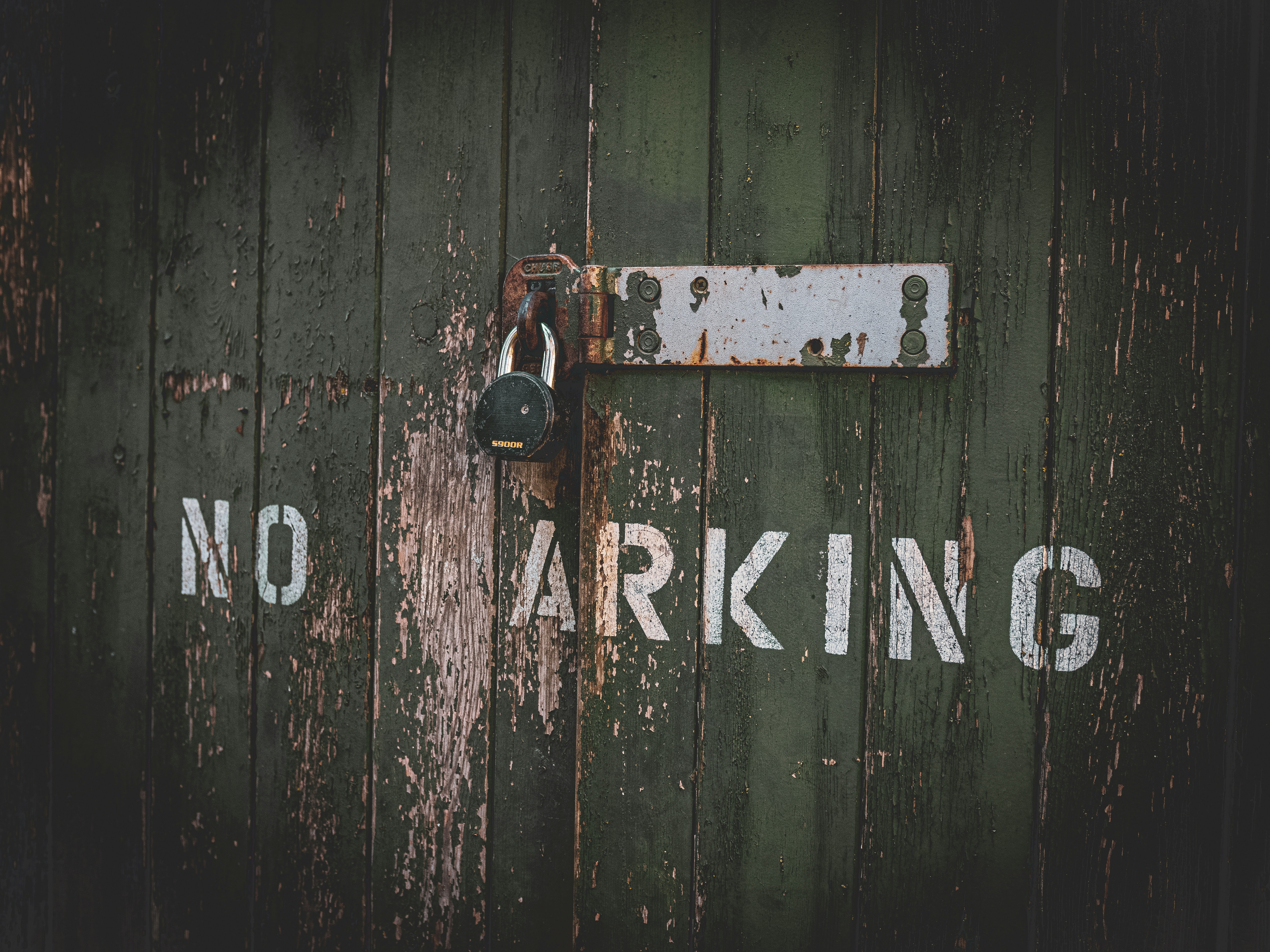 A door with a lock and no parking sign on it