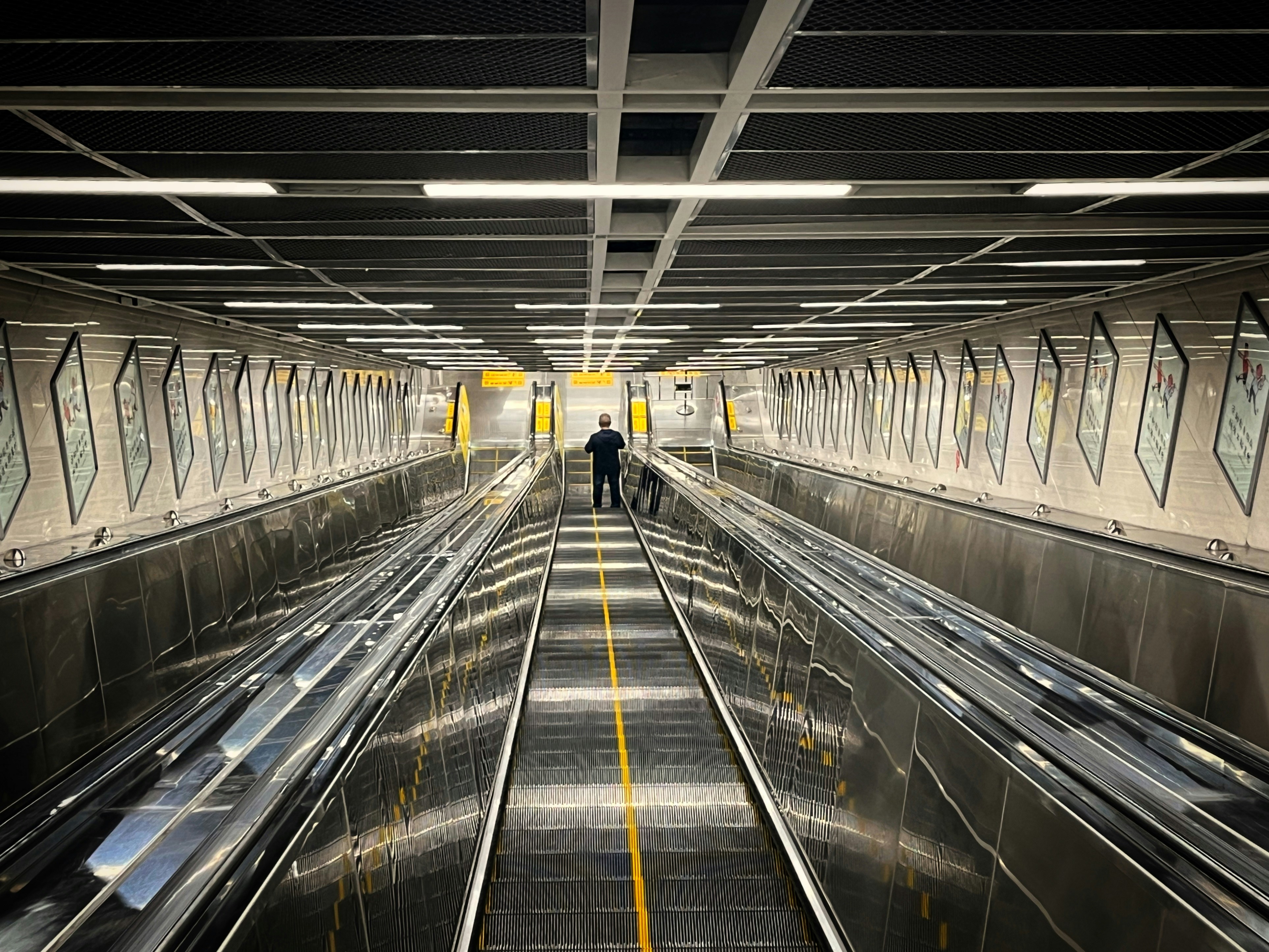 A subway station with several trains on the tracks