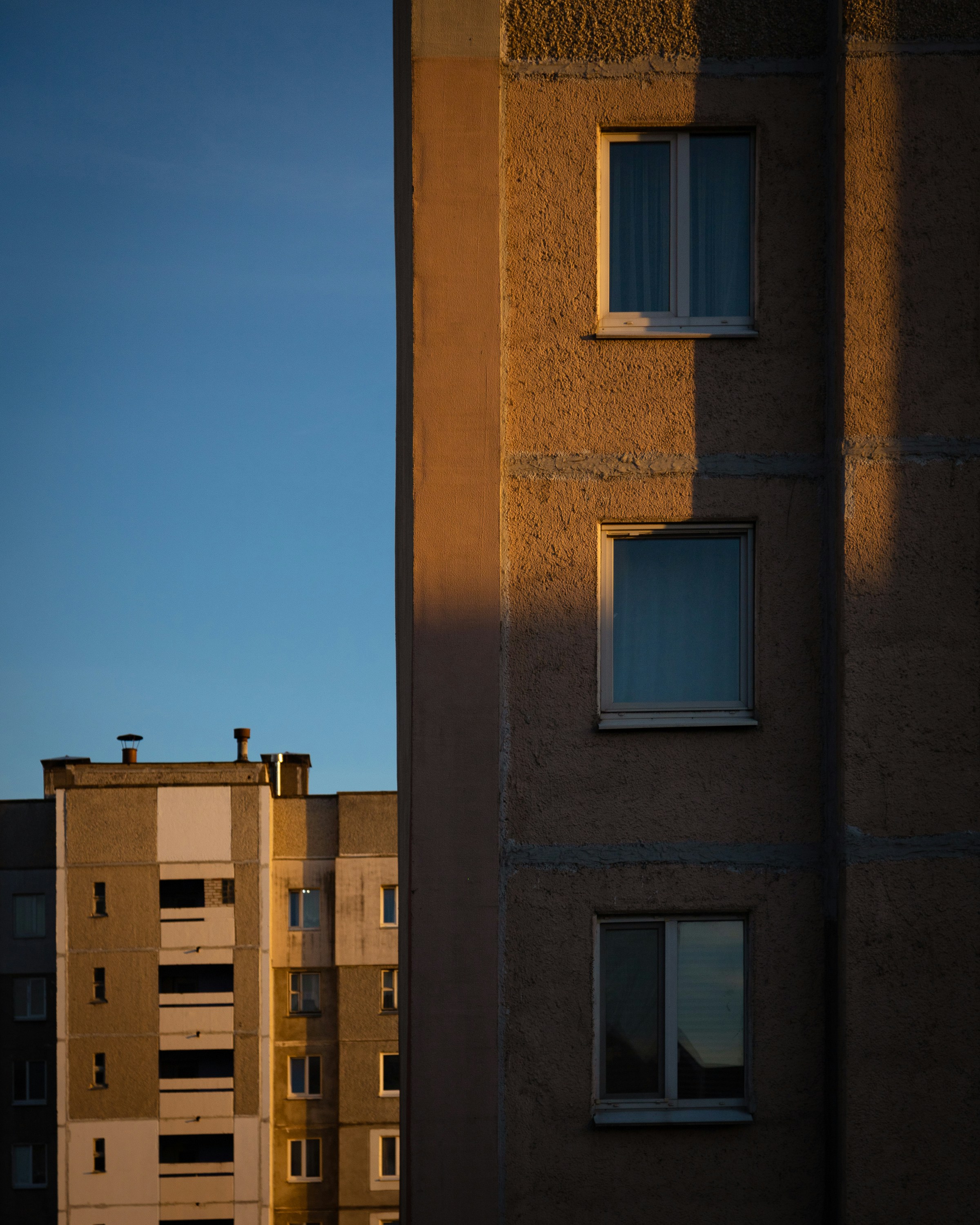 A tall building sitting next to a tall building