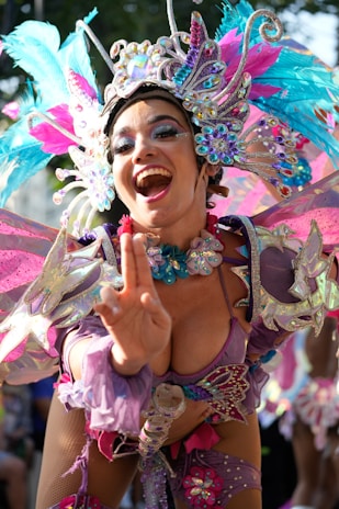 A woman in a costume is making a peace sign