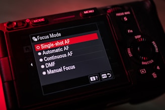 A close up of a camera with a red light