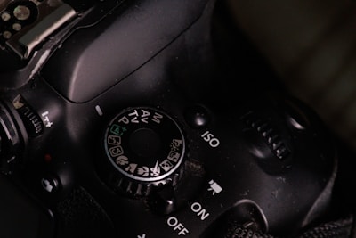 A close up of a camera with a black background