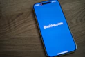 A blue samsung phone with the logo of bookking com on it