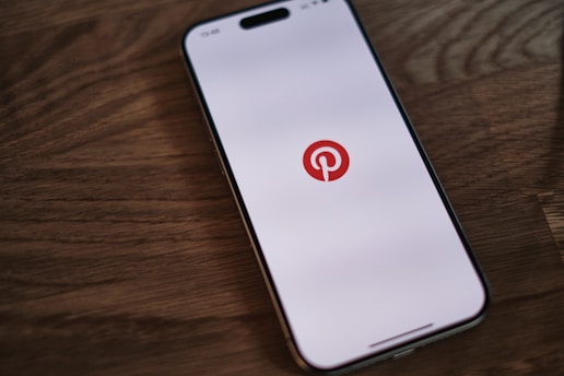 A cell phone with a pin on the screen
