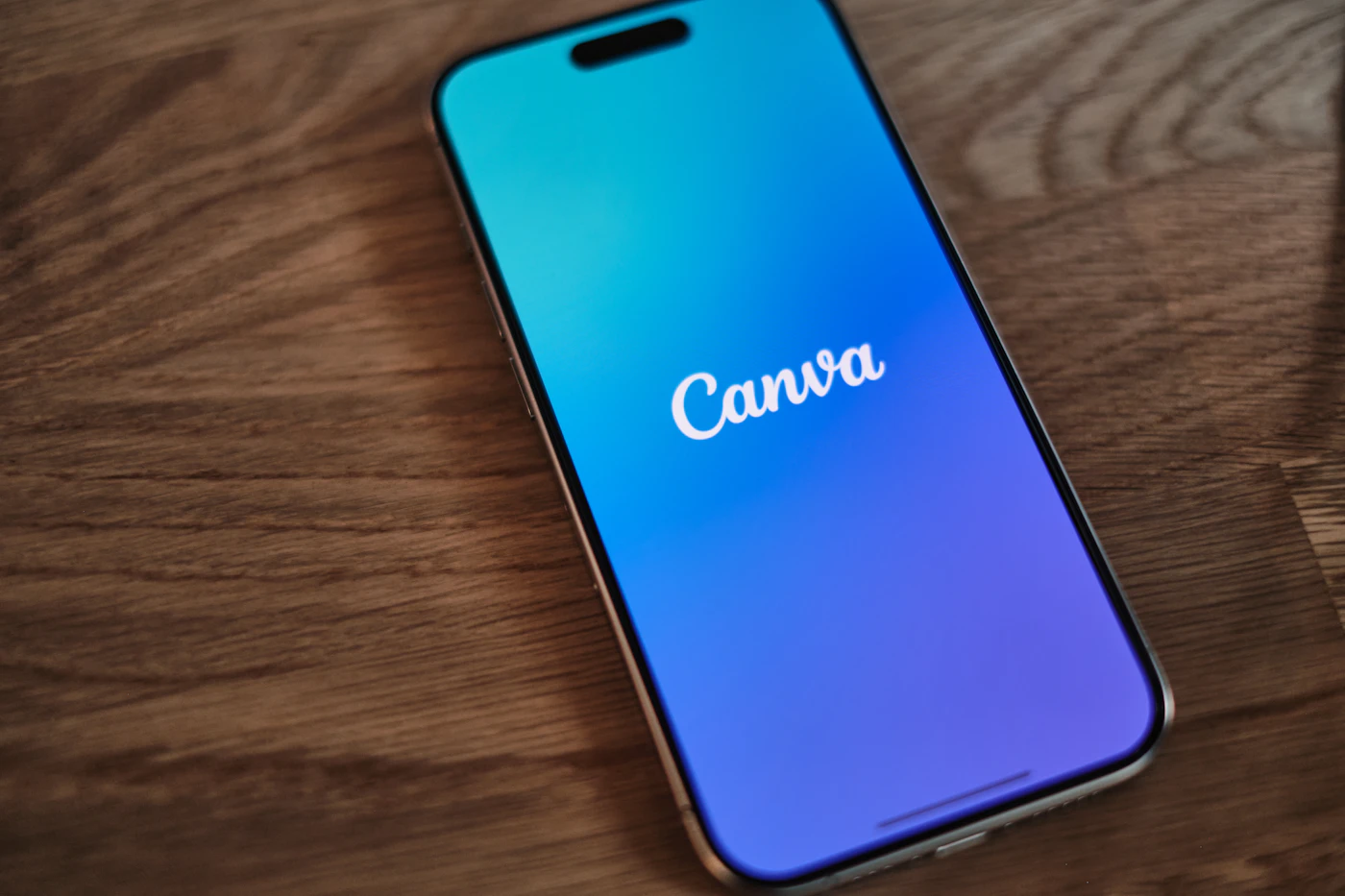 A phone lying on a wooden table