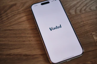 A white iPhone with the word united on it