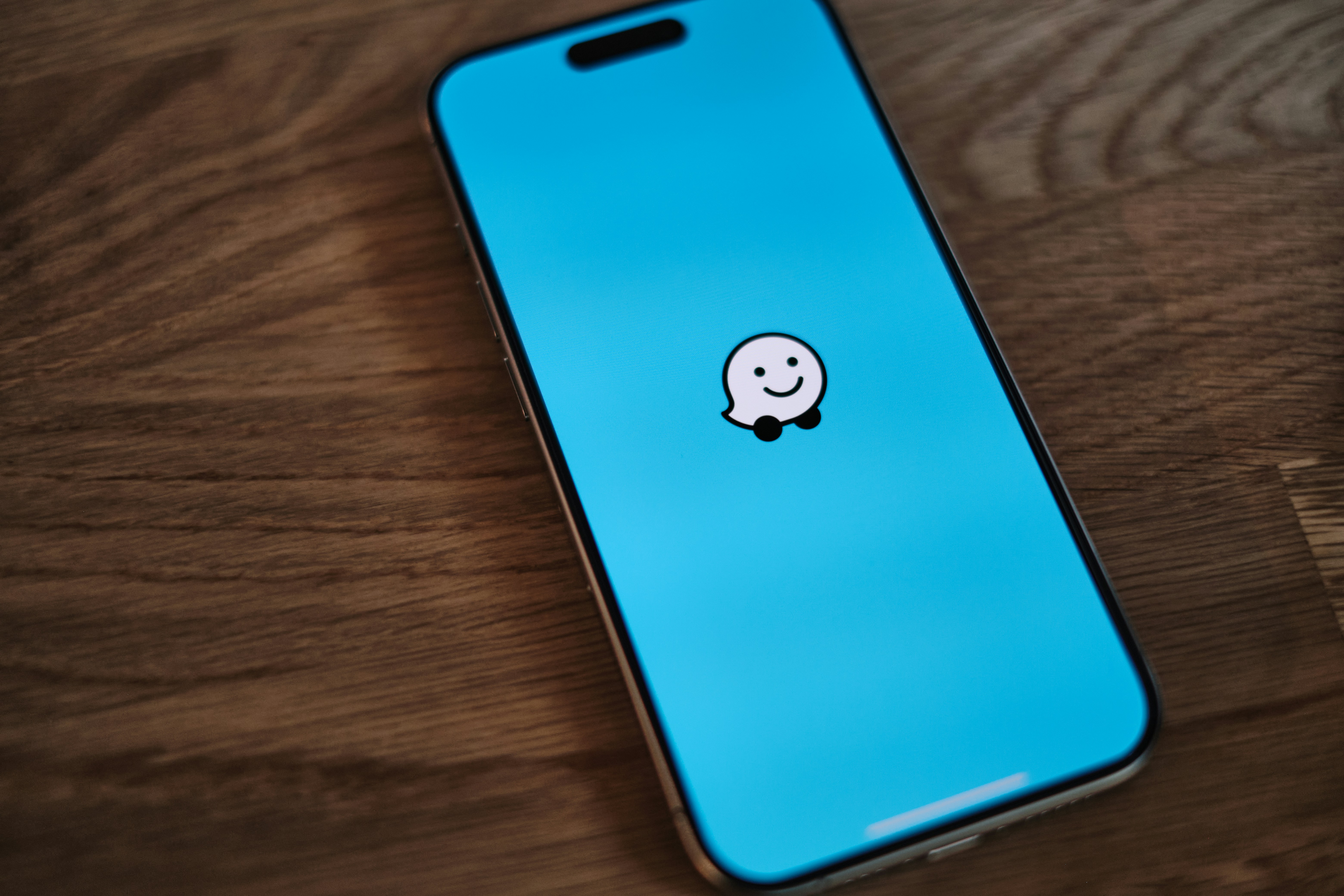 A phone with a sticker of a smiley face on it