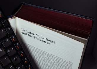 A book with a keyboard on top of it