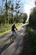 A person riding a bike down a country road