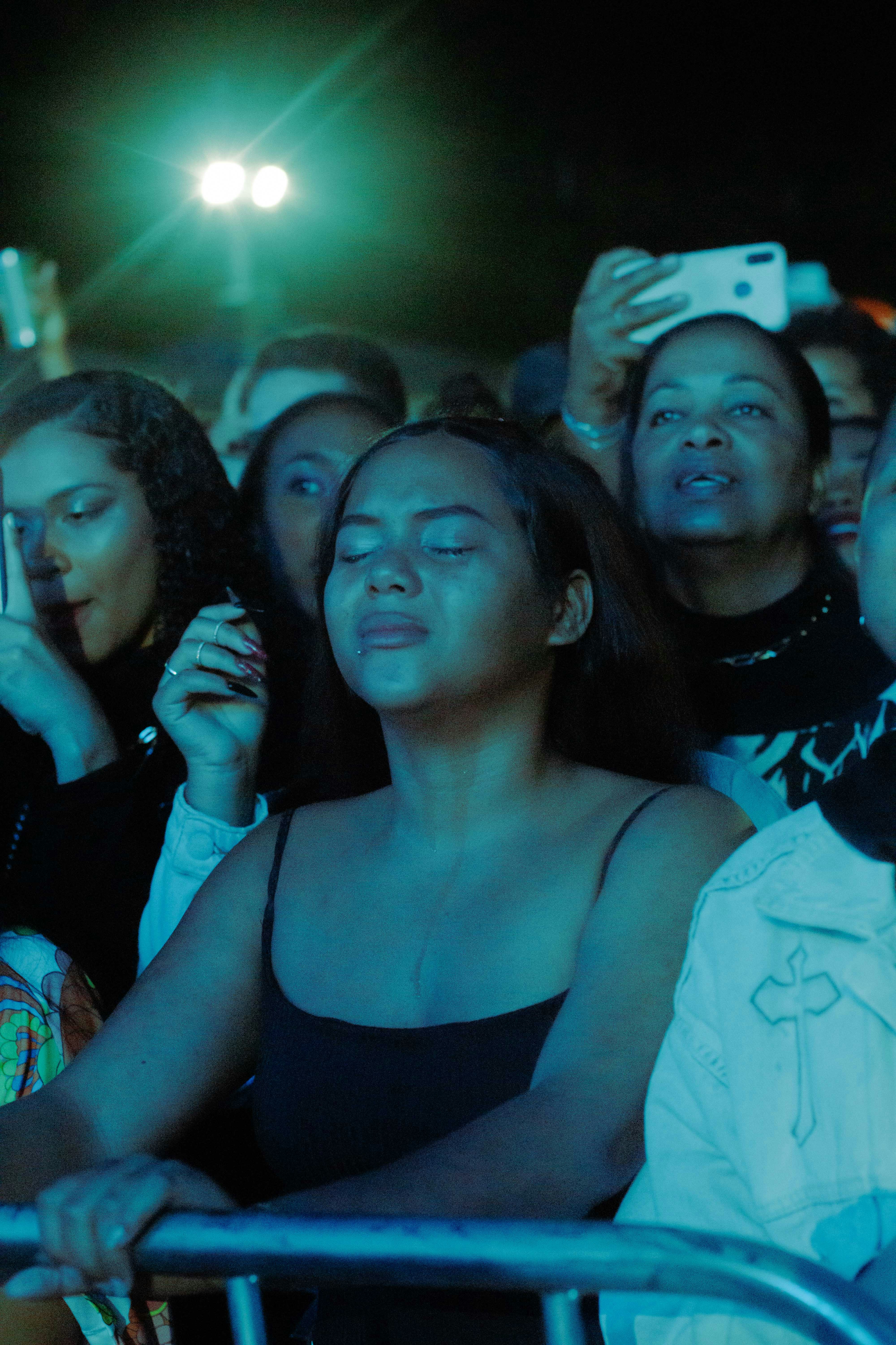 A group of people sitting next to each other