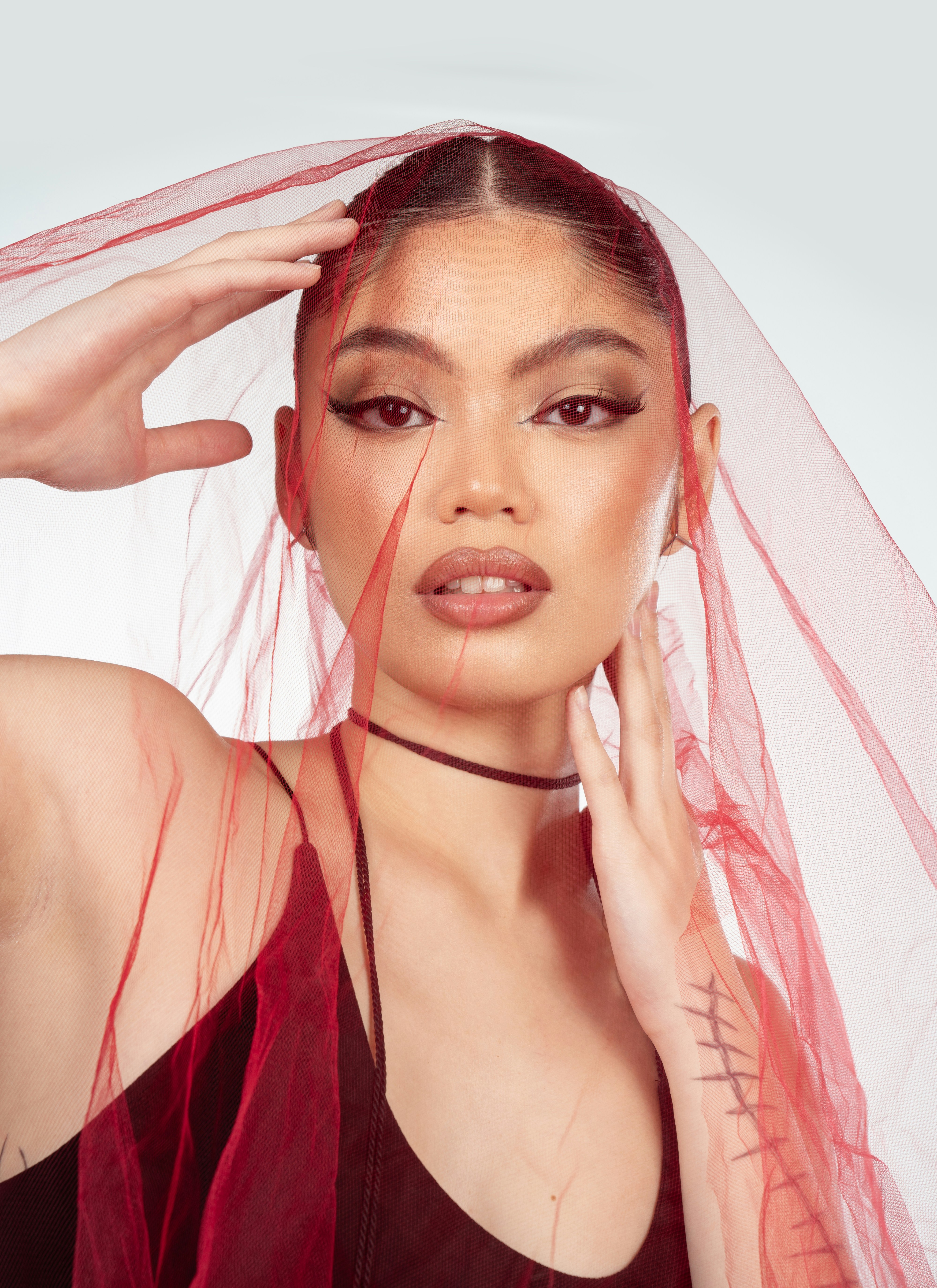 A woman with a veil on her head