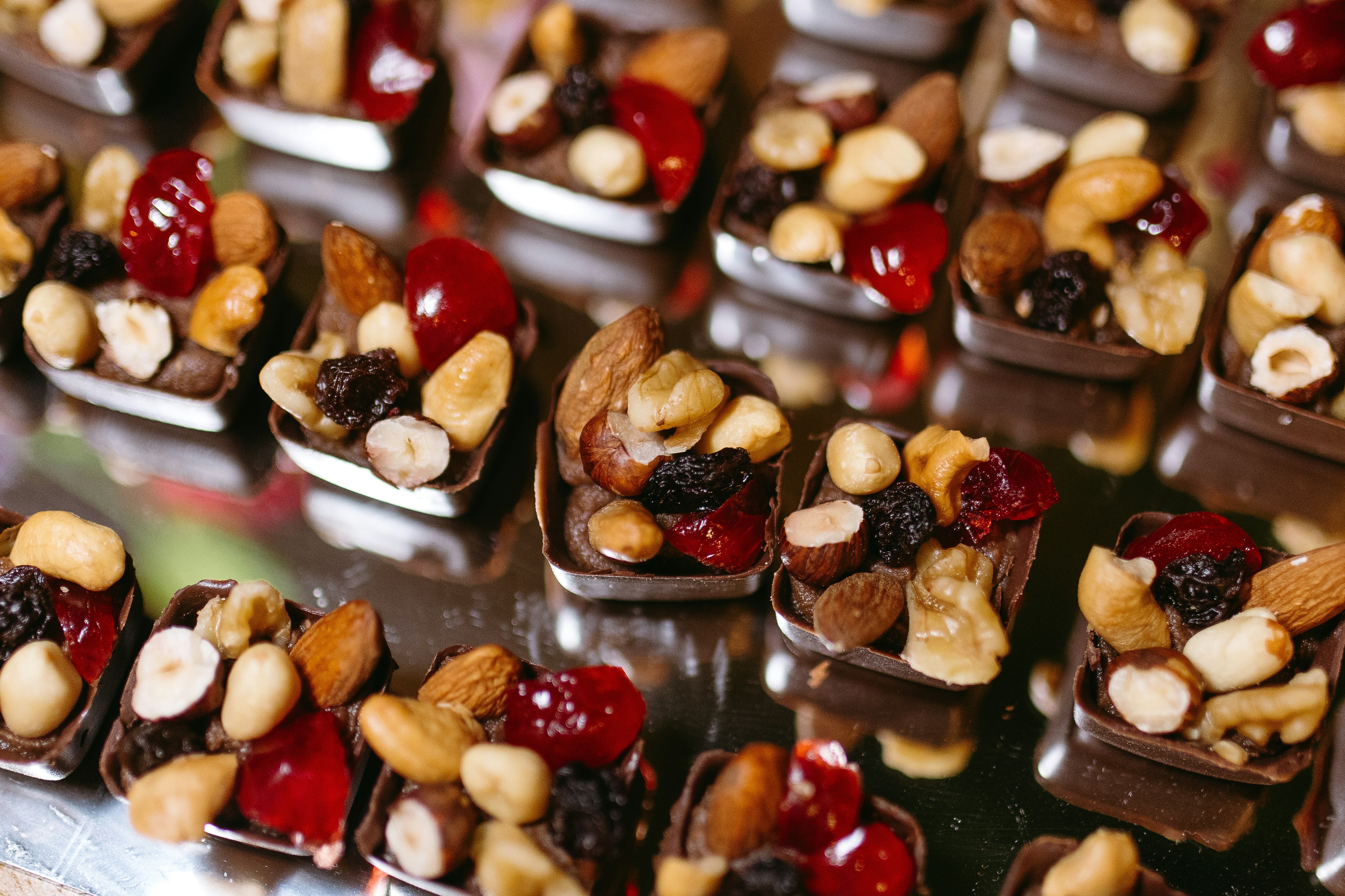 A table topped with lots of chocolate covered desserts