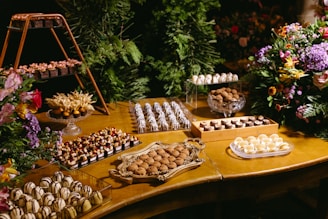 A wooden table topped with lots of desserts
