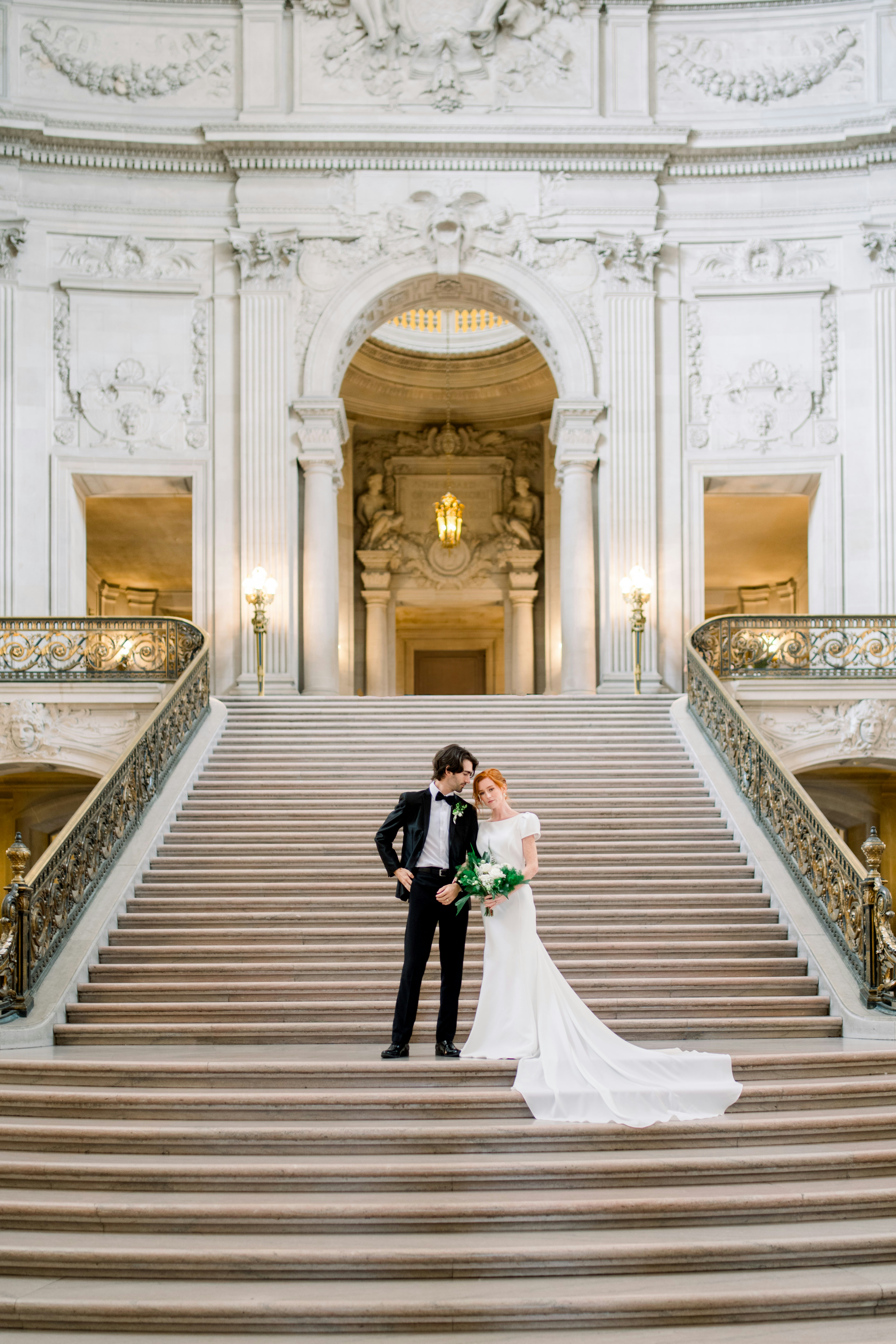 A bride and groom standing on the steps of a building photo – Free San ...