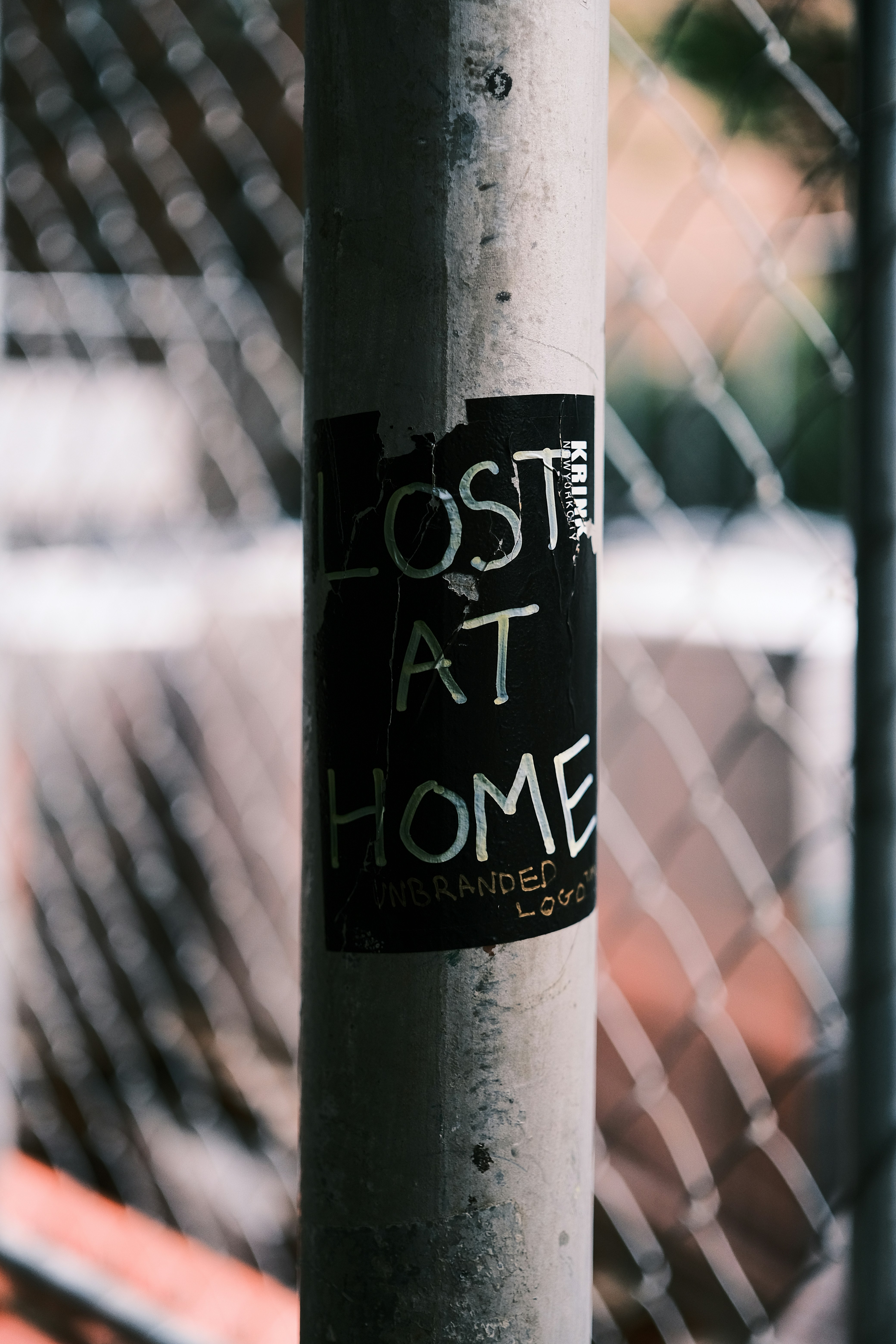 A post with a sign that says lost at home