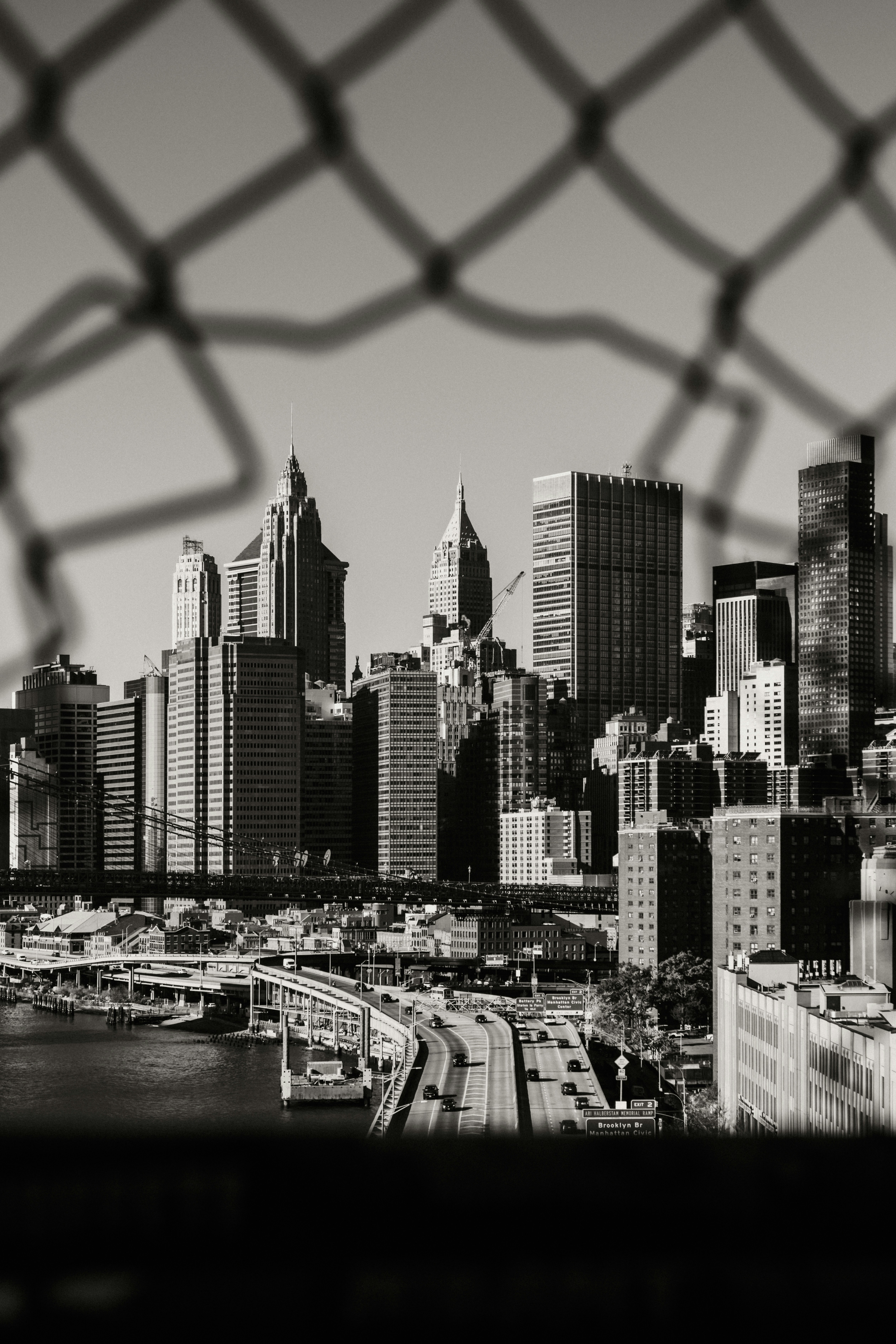 A view of a city through a fence