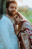 A man and a woman dressed in traditional indian garb