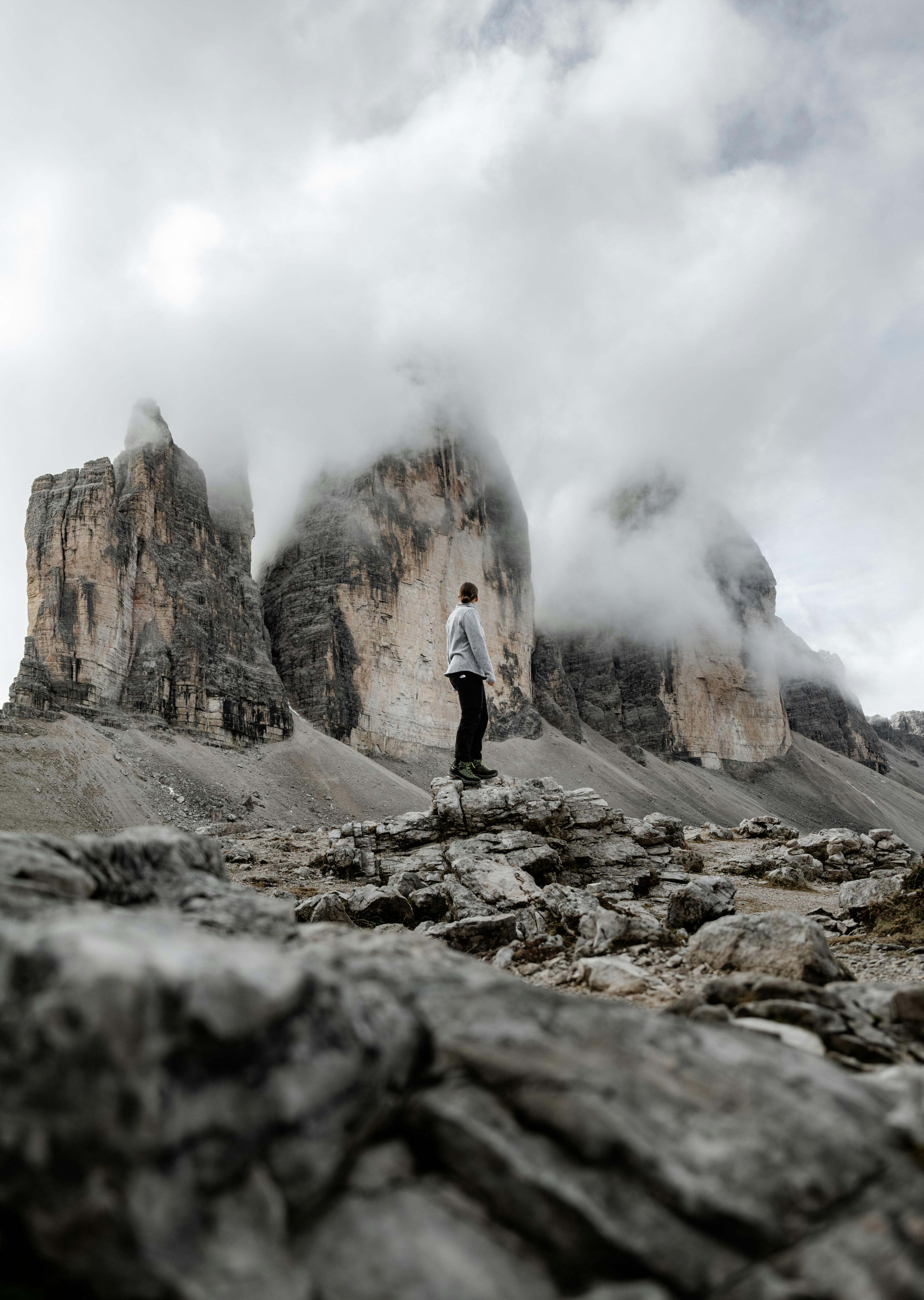 A man standing on top of a rocky mountain