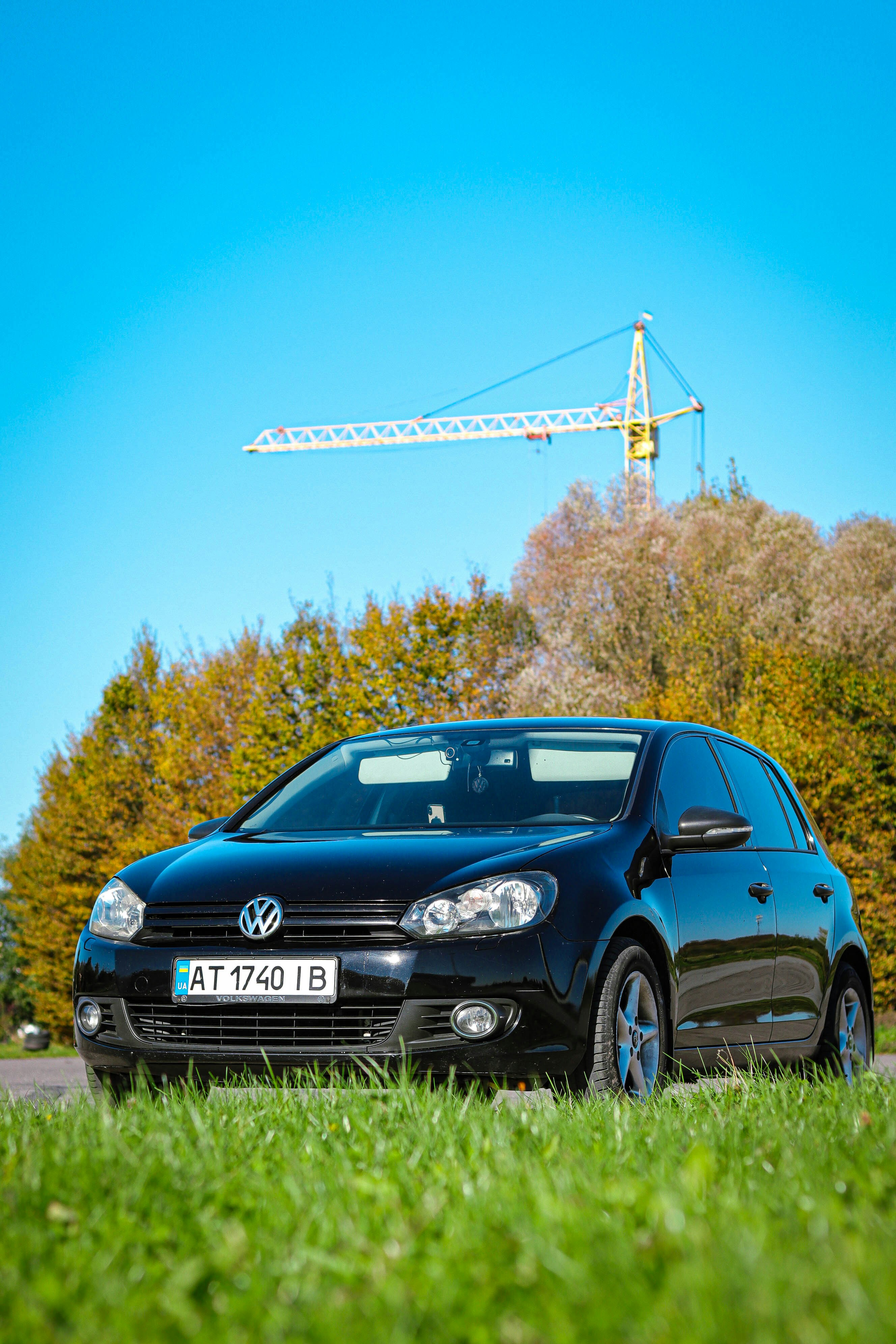 A black car parked on the side of a road