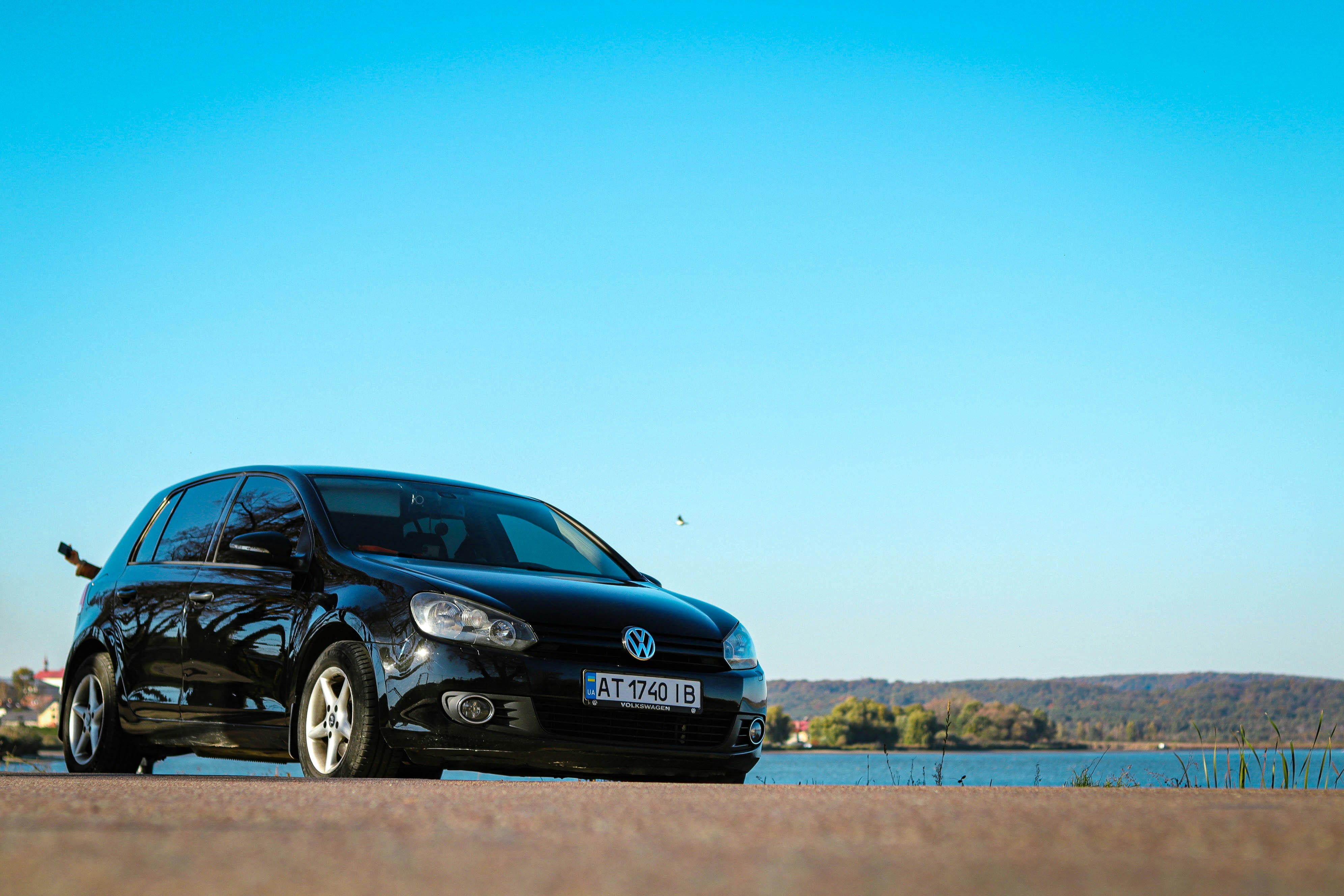 A black car parked on the side of the road