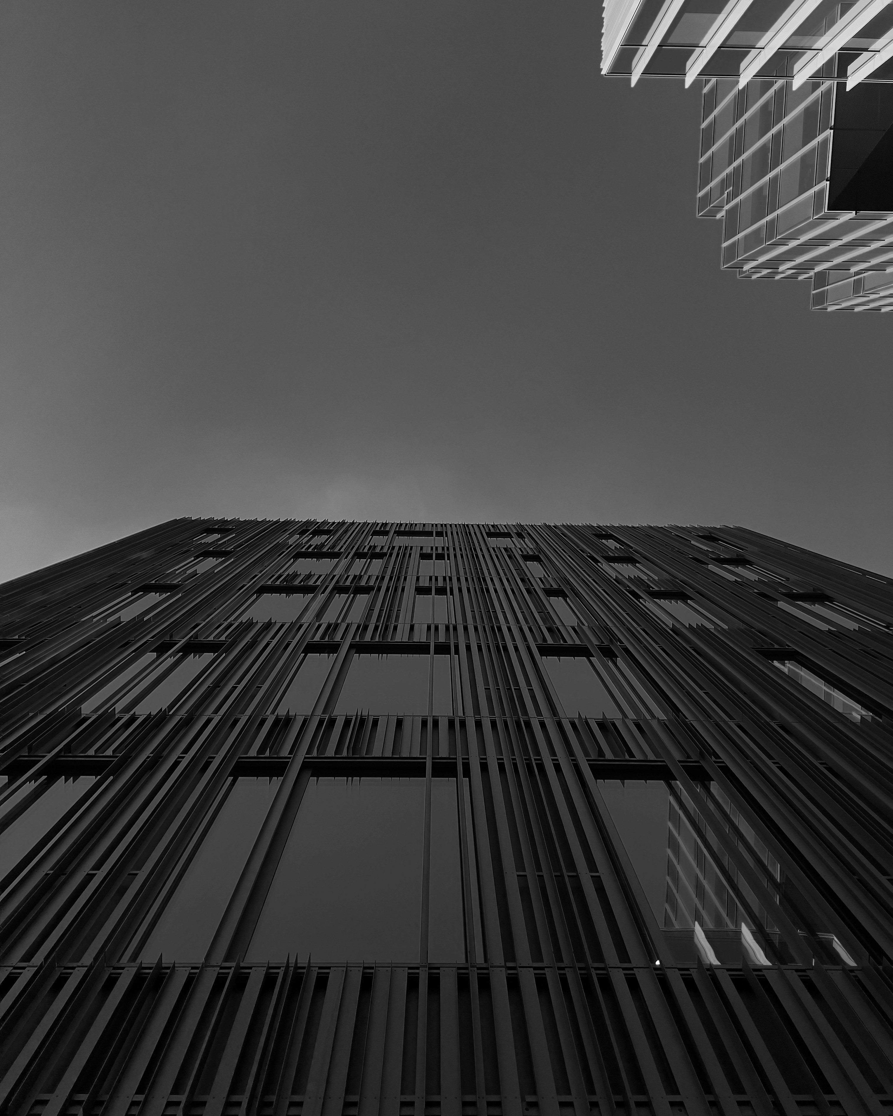 A black and white photo of a tall building
