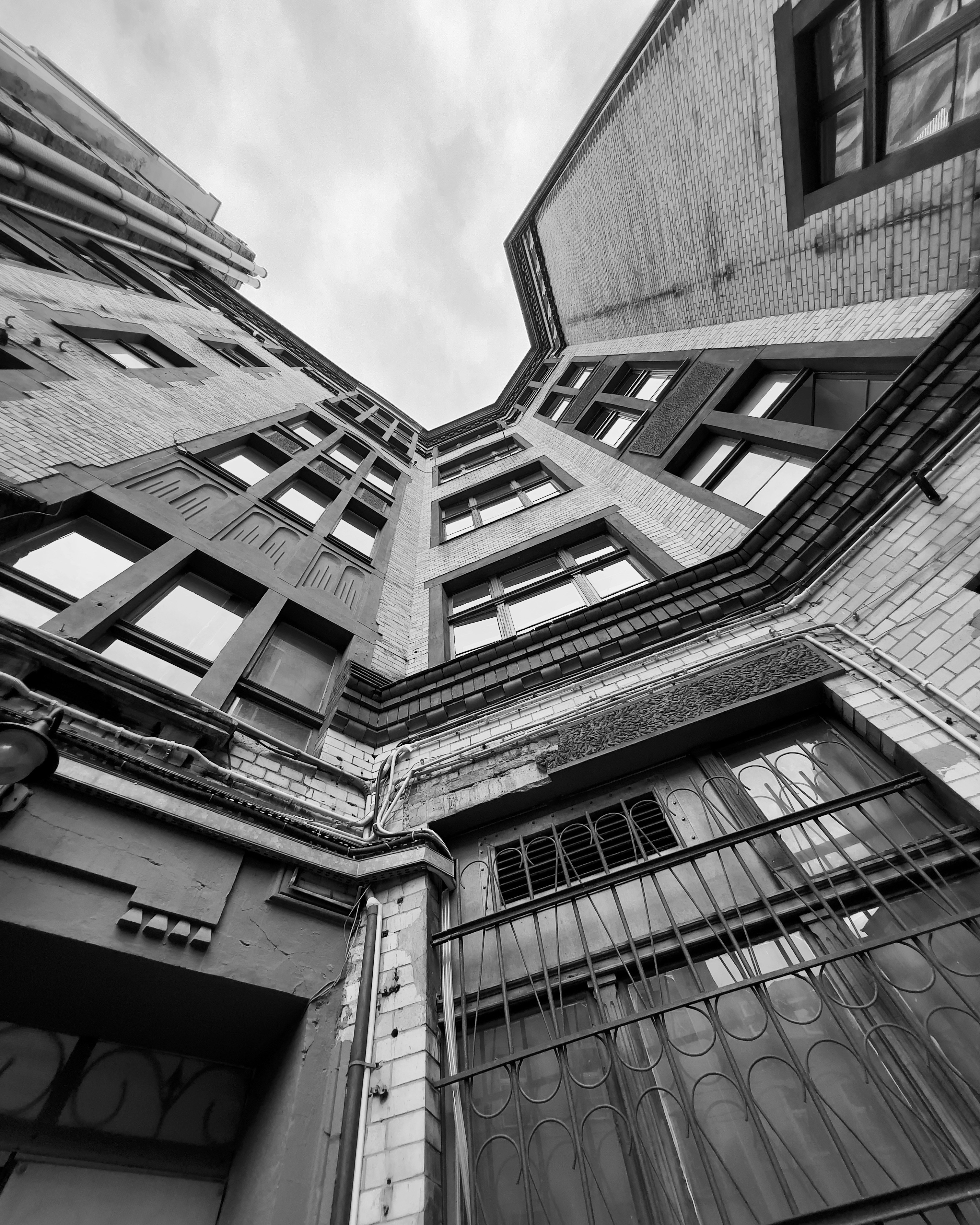 A black and white photo of tall buildings