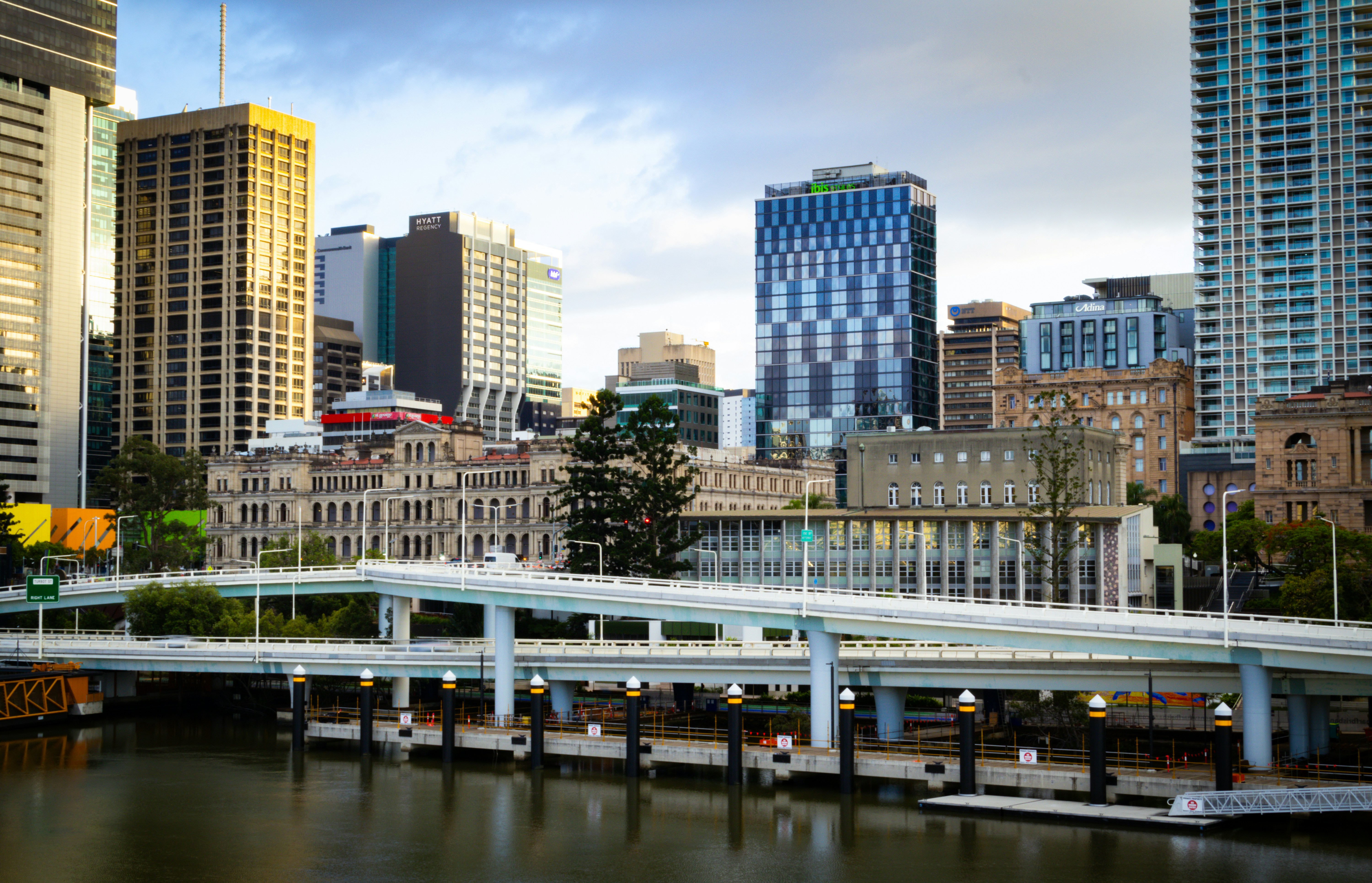 A bridge crossing over a river in a city