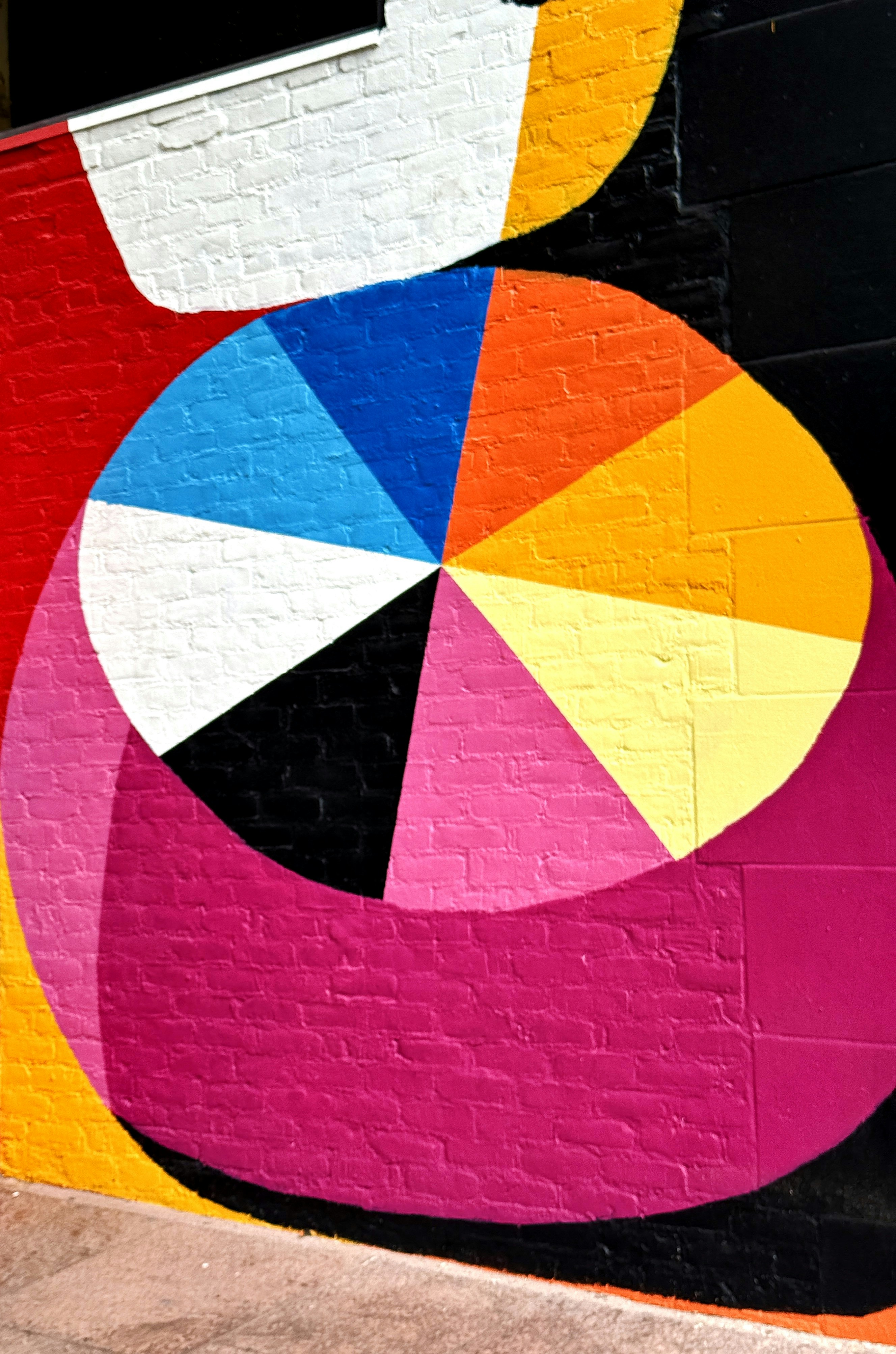 A colorful mural on the side of a building