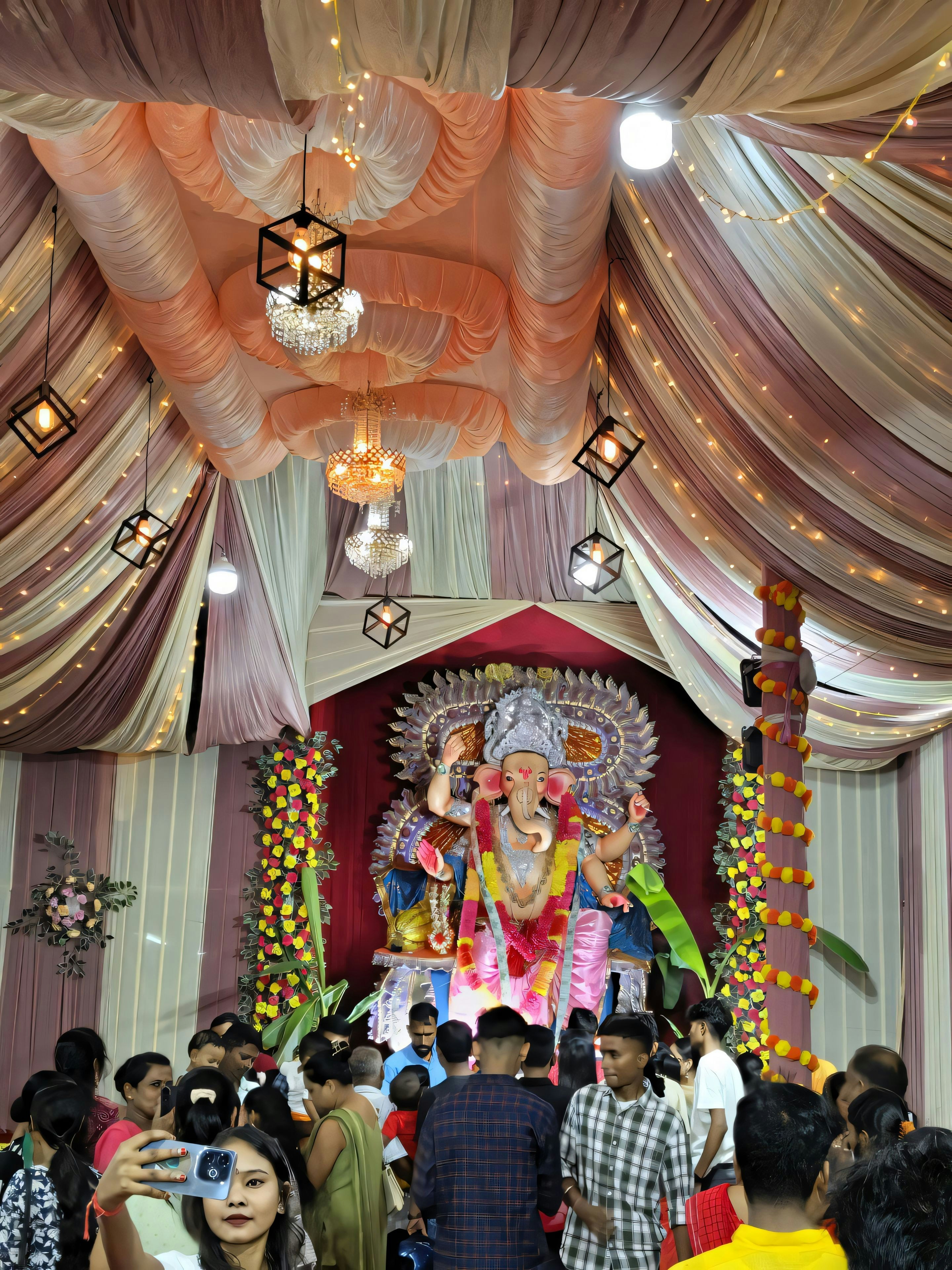 A group of people standing in front of a statue