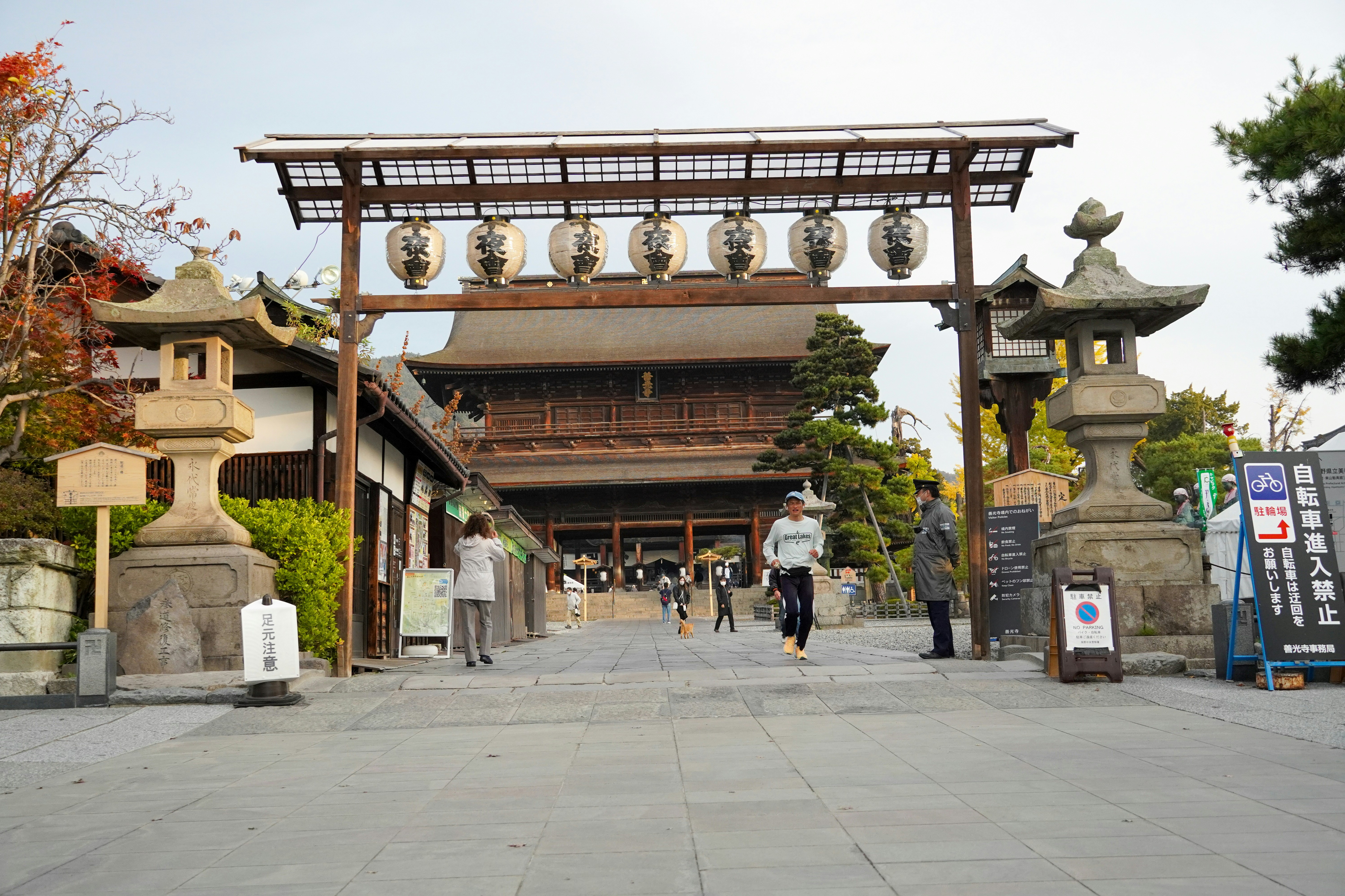 A group of people standing in front of a building