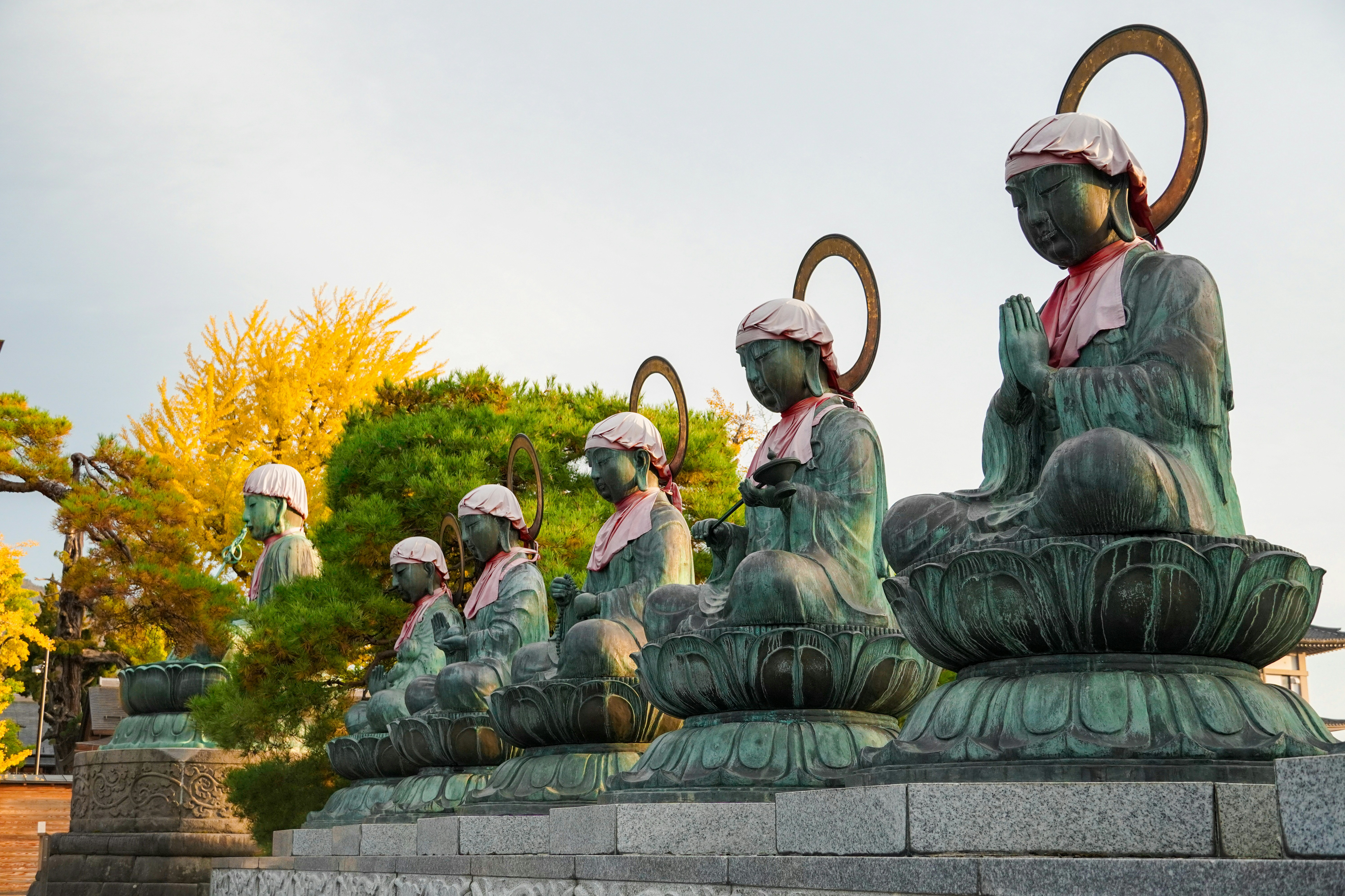 A group of statues sitting next to each other