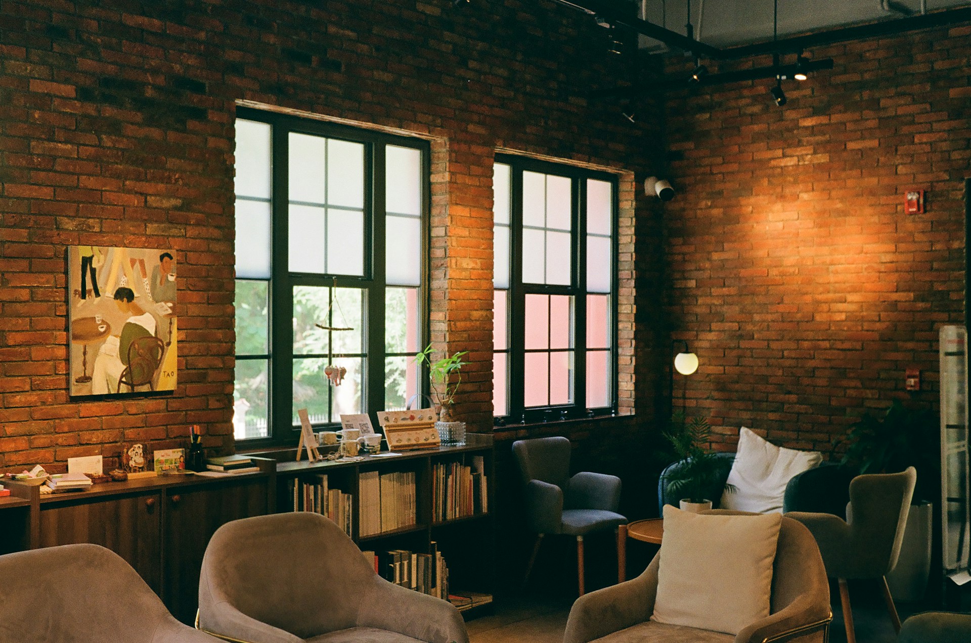 A living room filled with lots of furniture and windows