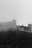 A black and white photo of a castle on a hill