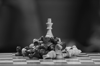 A black and white photo of a chess set