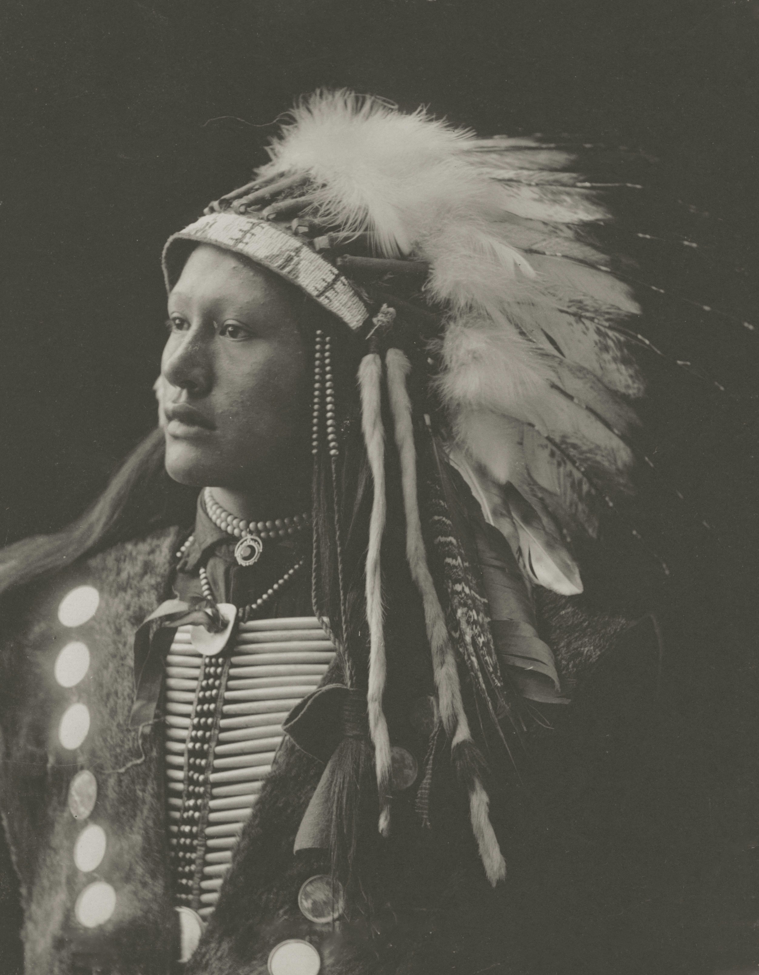 Man in traditional native american headdress and regalia