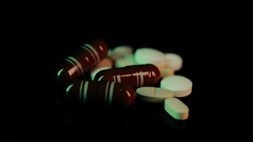 A close up of a bunch of pills on a table