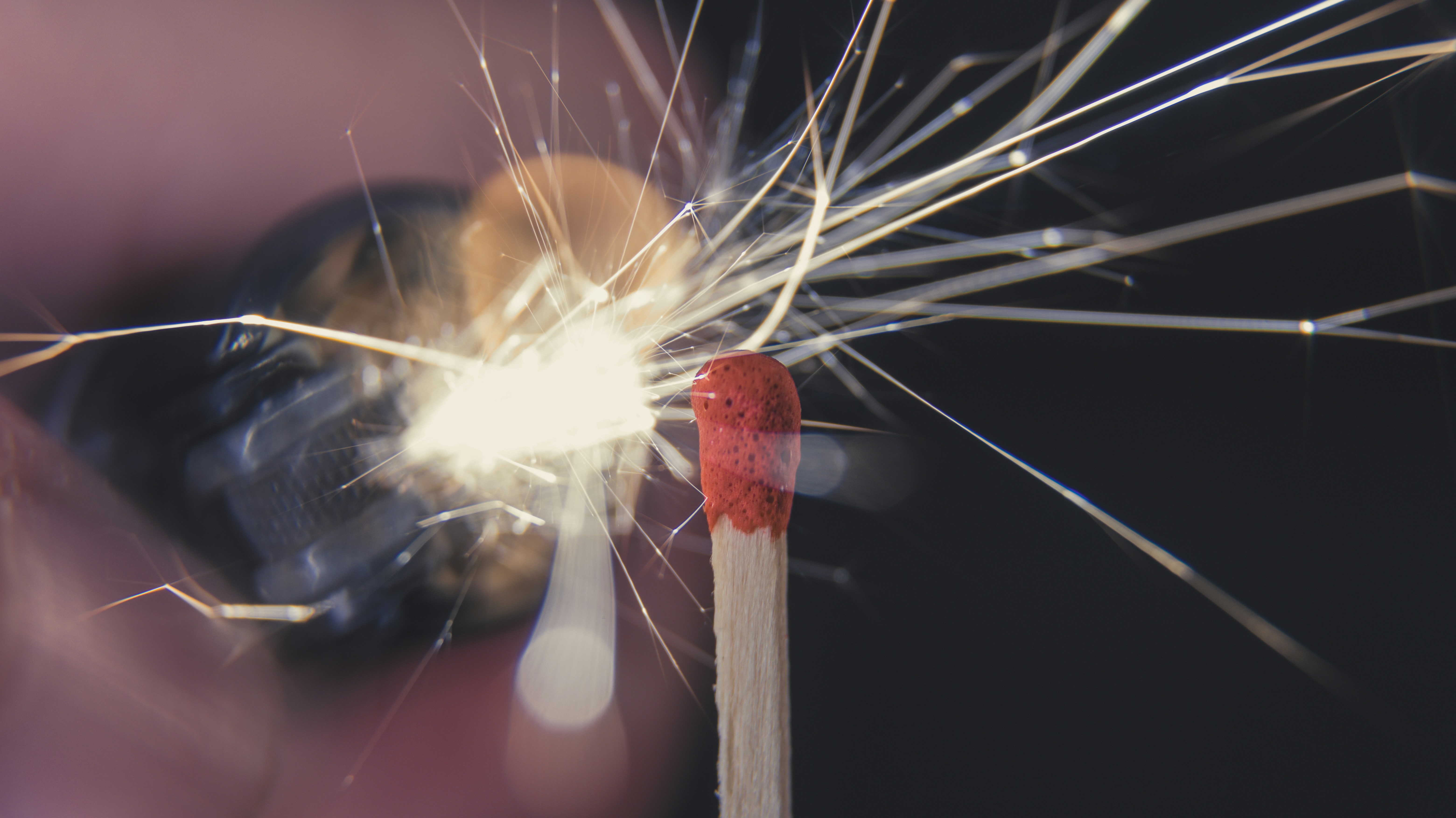 A close up of a person holding a sparkler