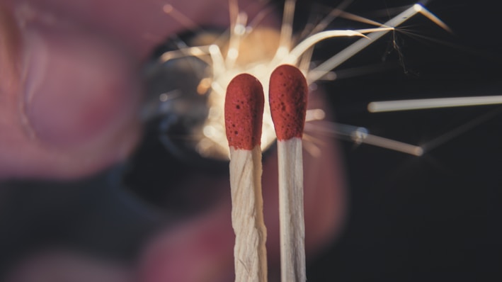 Two matchsticks sticking out of a match