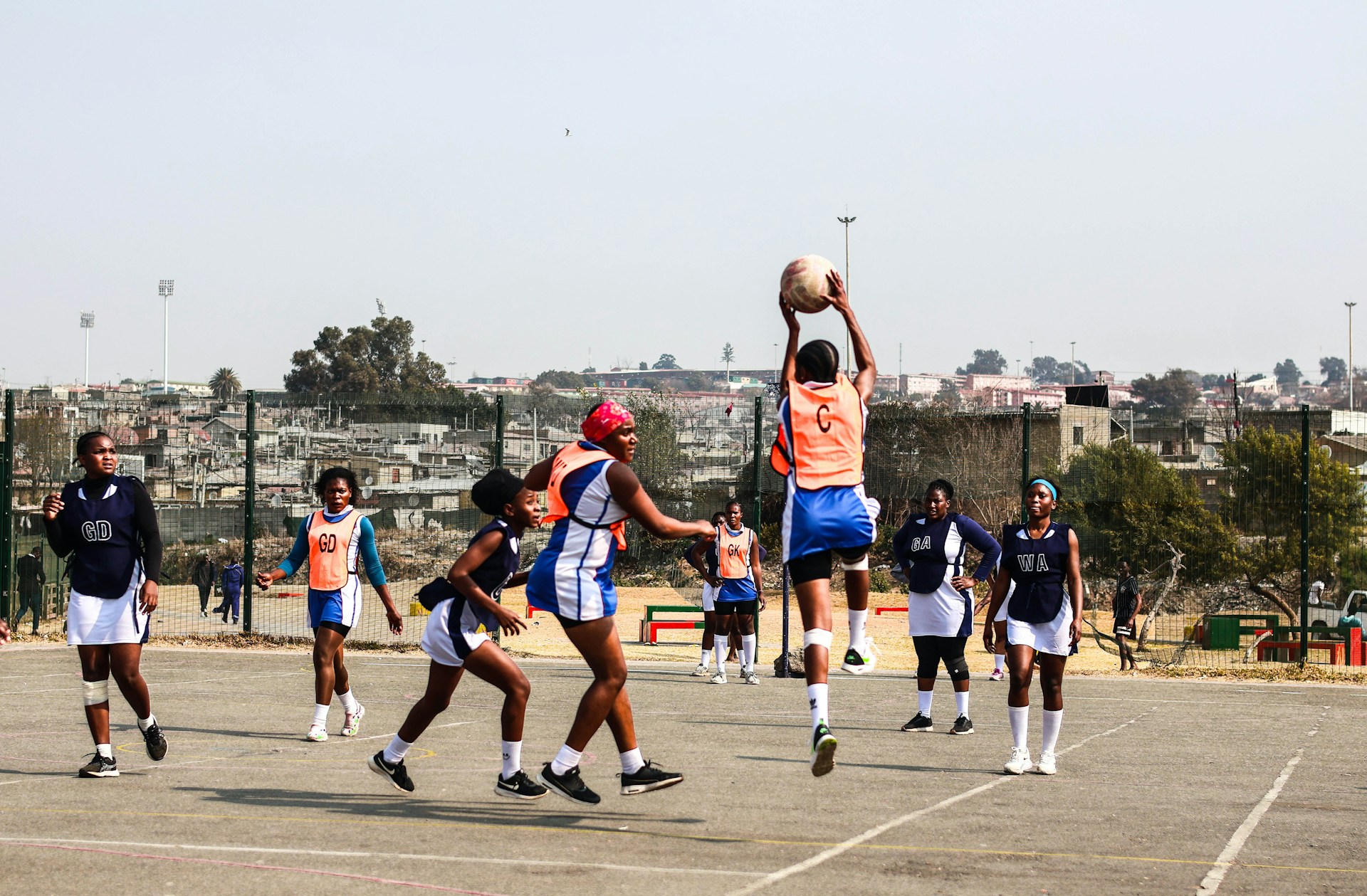 A group of young men playing a game of basketball