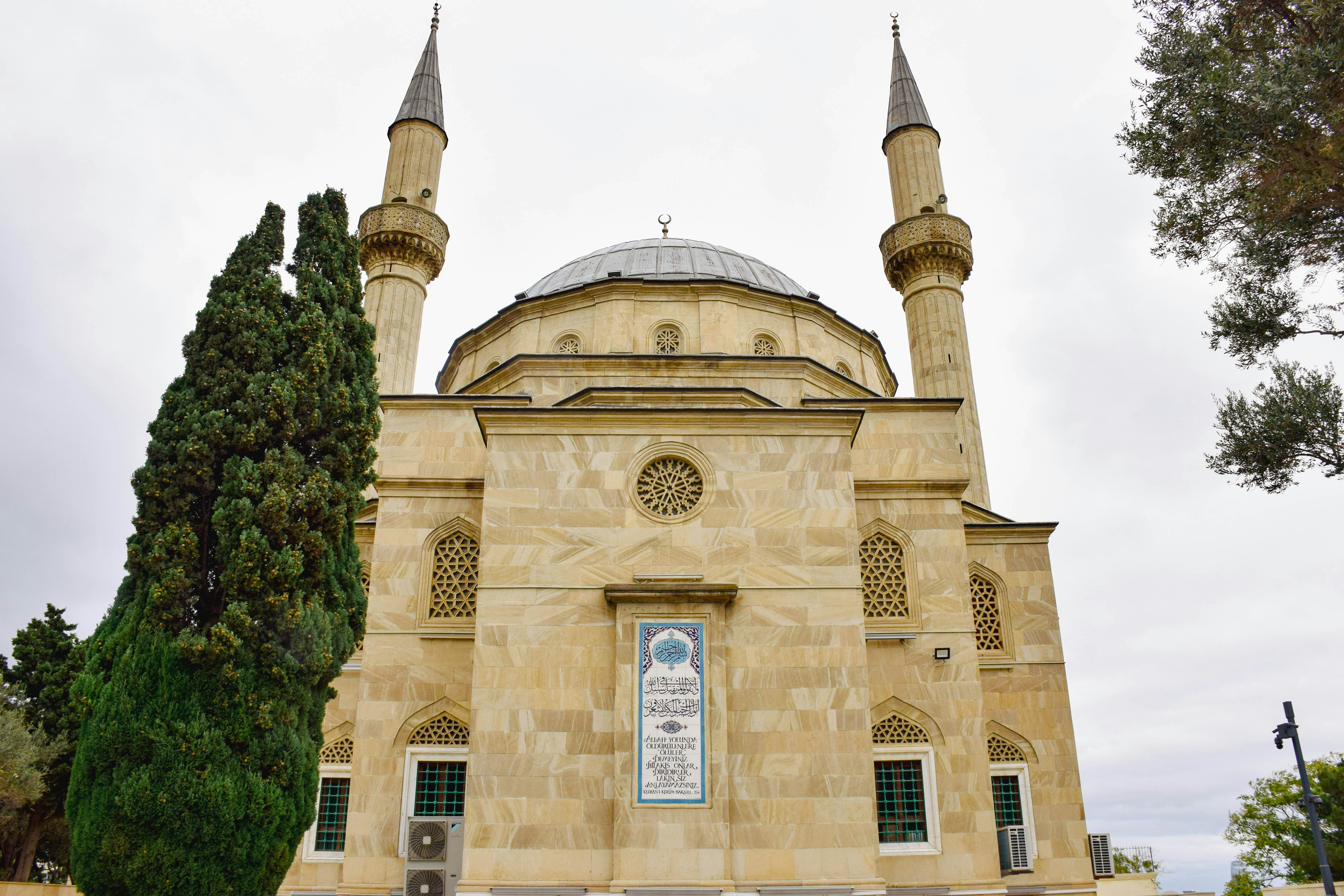A large stone building with two towers