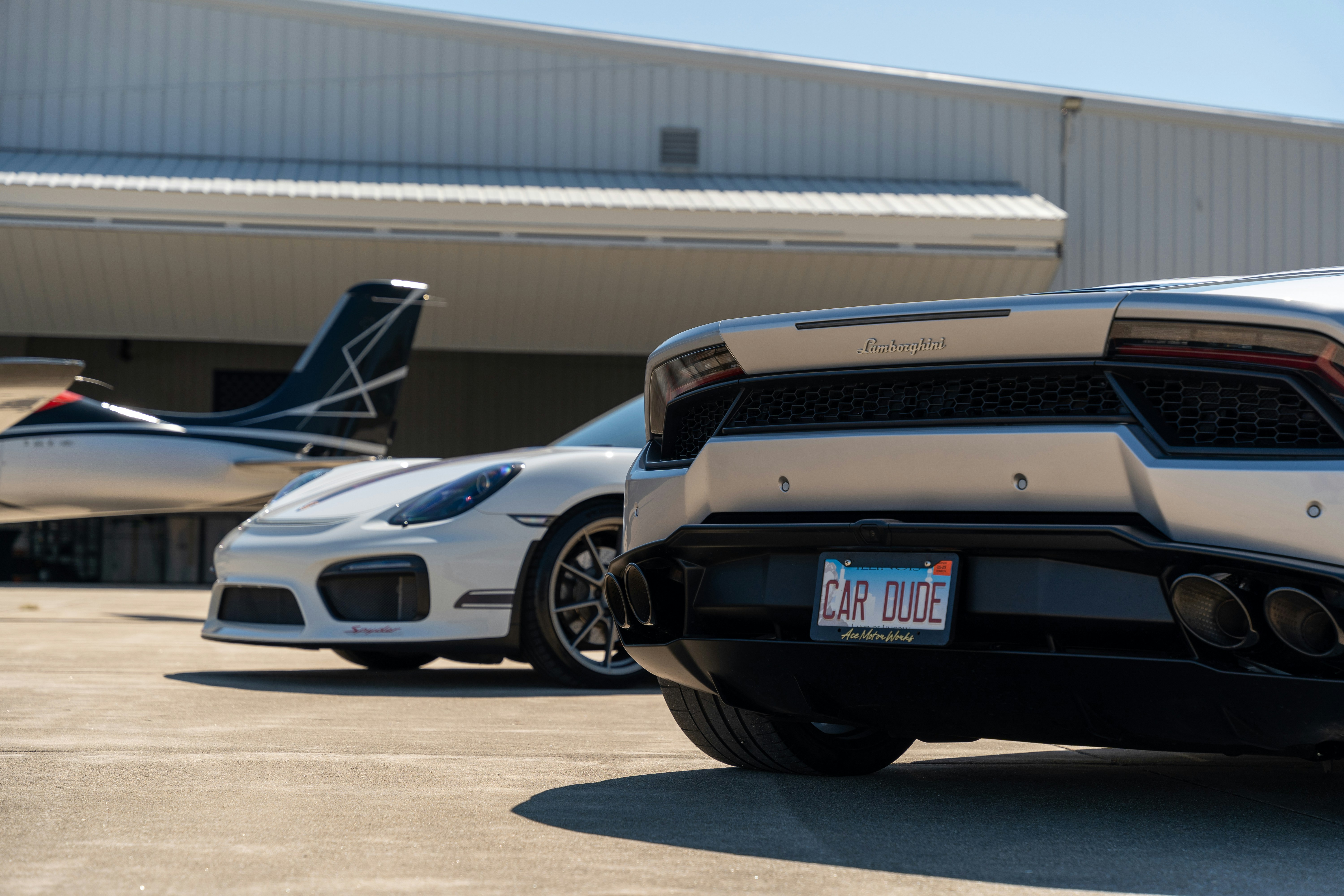 Tesla Model 3 sedan and Model Y SUV parked side by side in a lot