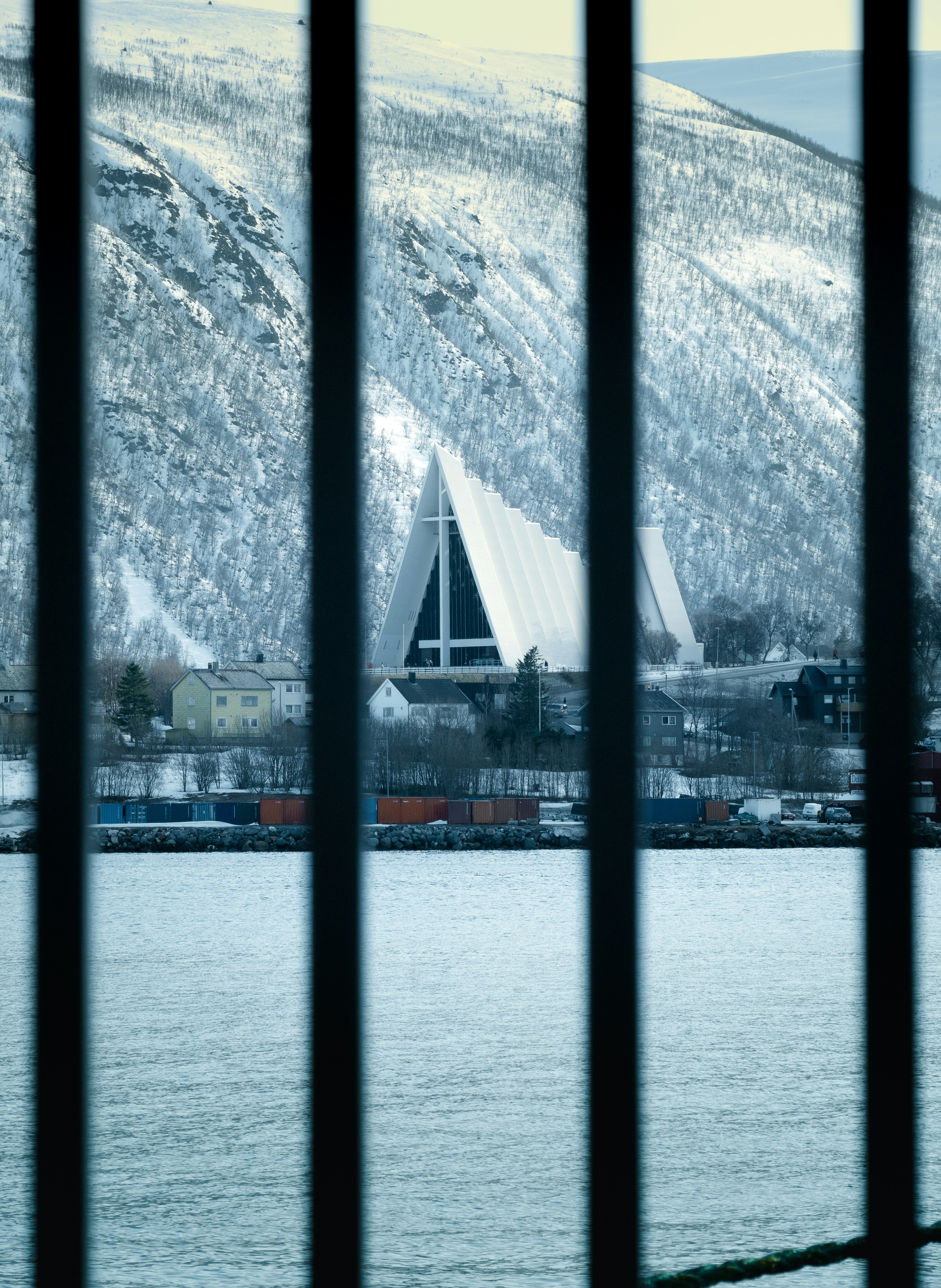 A large body of water with a mountain in the background