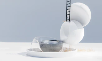 A white plate topped with a fork and a bowl