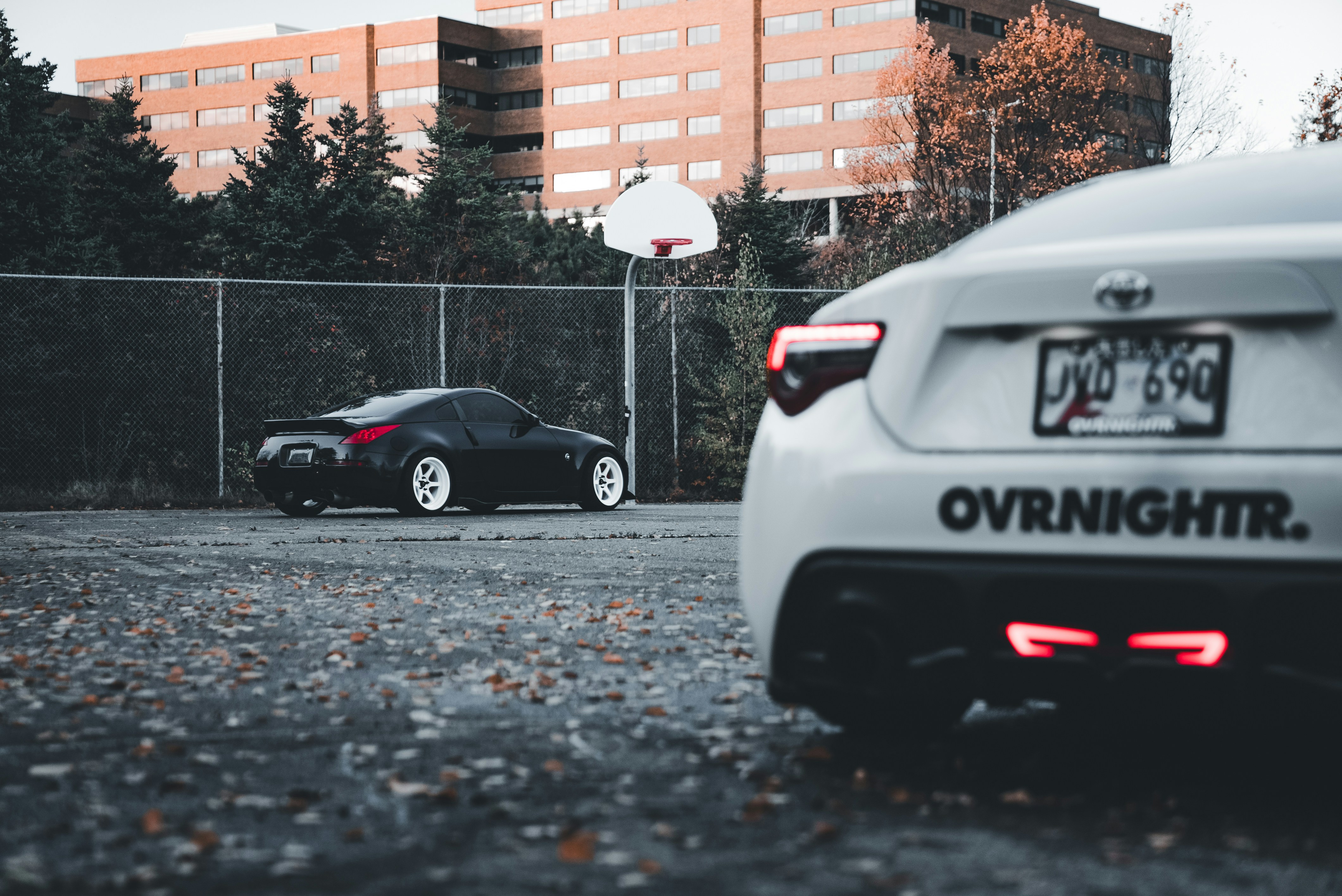A couple of cars parked in a parking lot