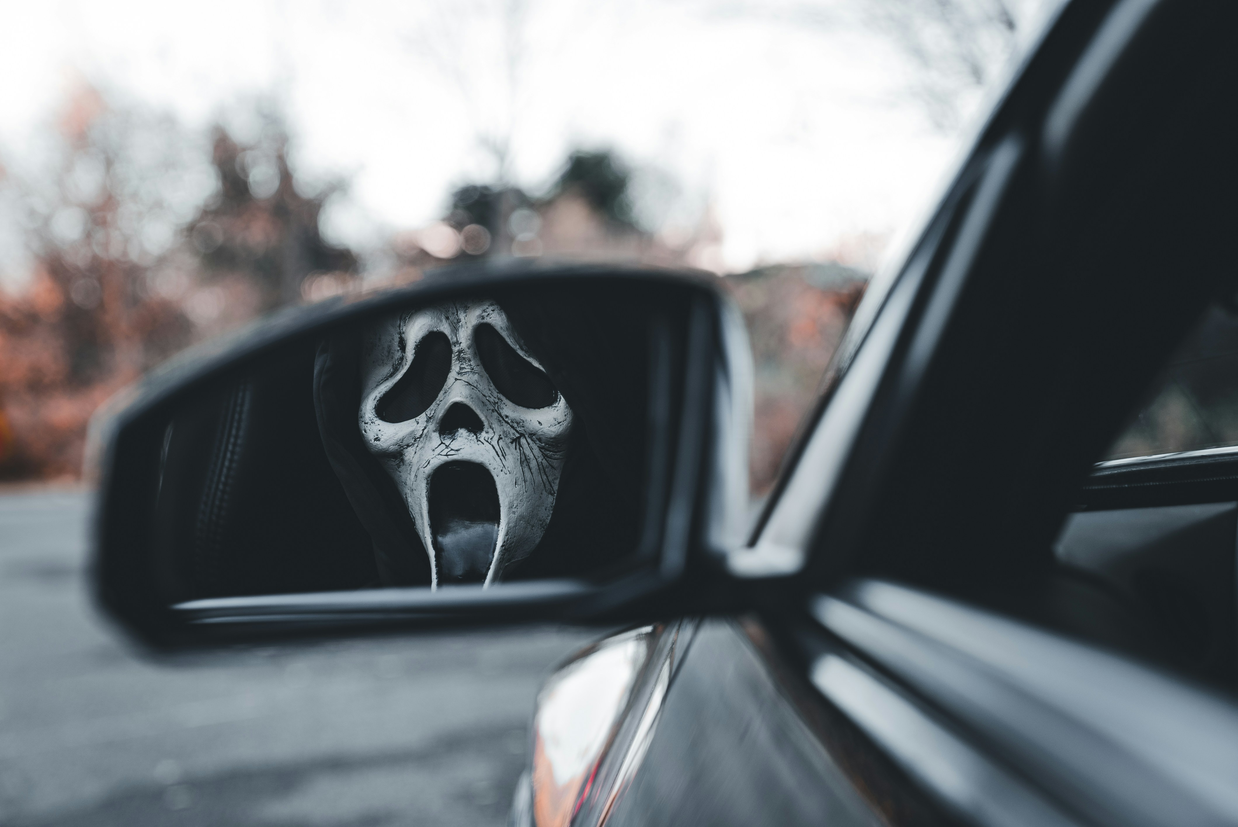 Spooky car dealership with skeleton