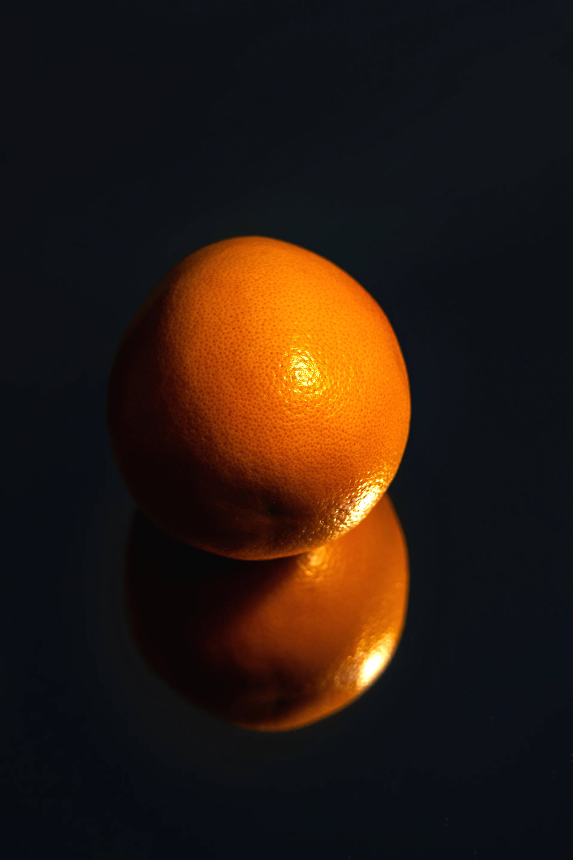 A couple of oranges sitting on top of a table